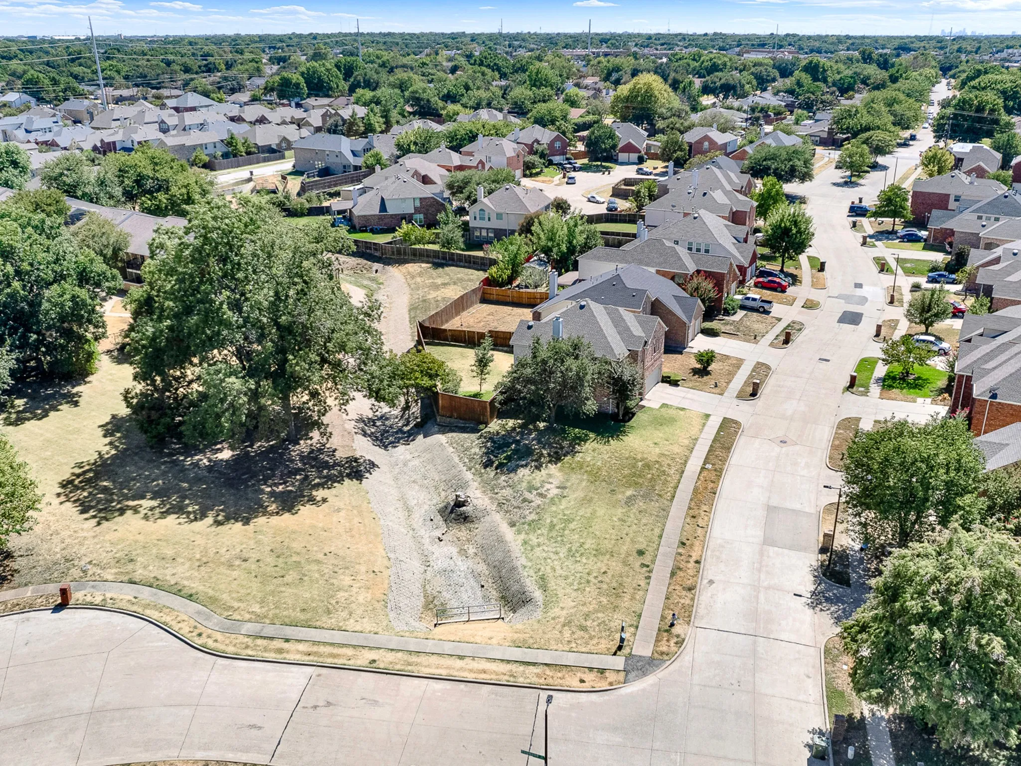 View of large corner lot with greenbelt