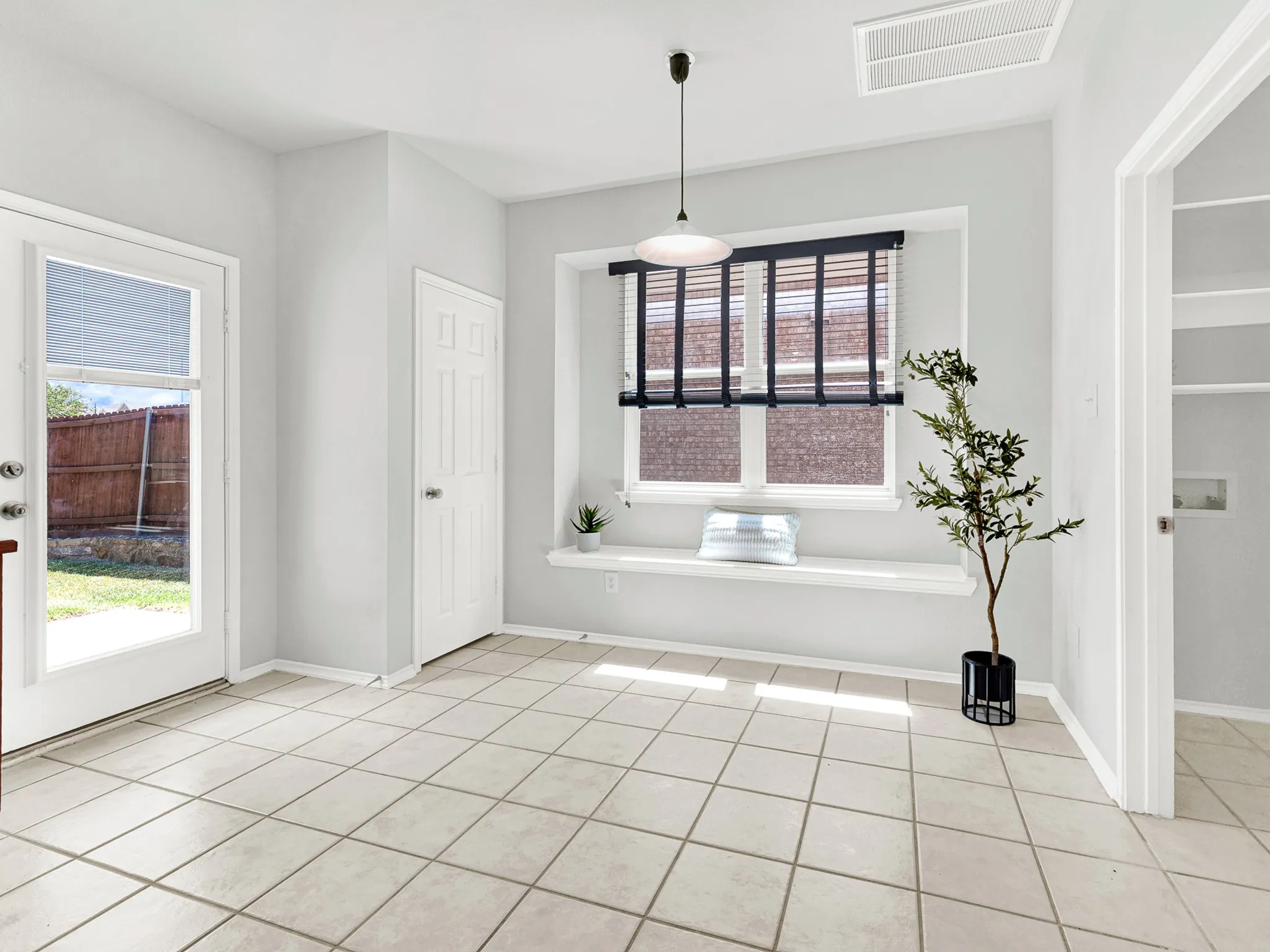 Breakfast room with French doors that exit to backyard