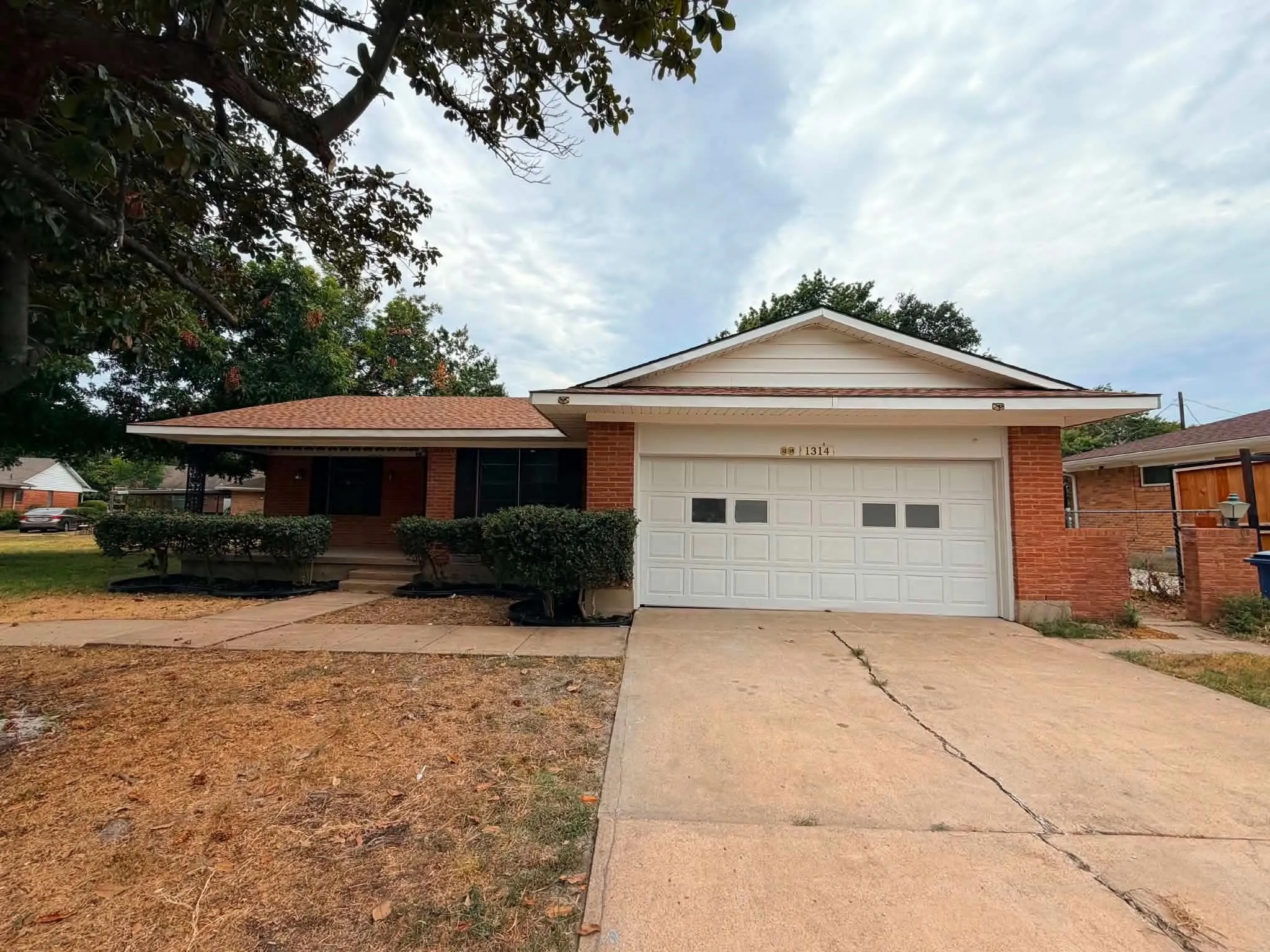 Brick facade with a covered porch entry