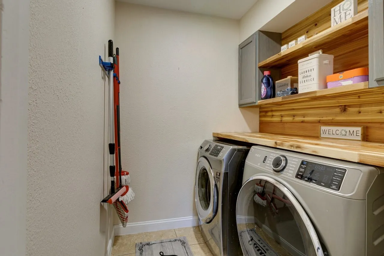 Built-in wood-finish shelving with a matching countertop