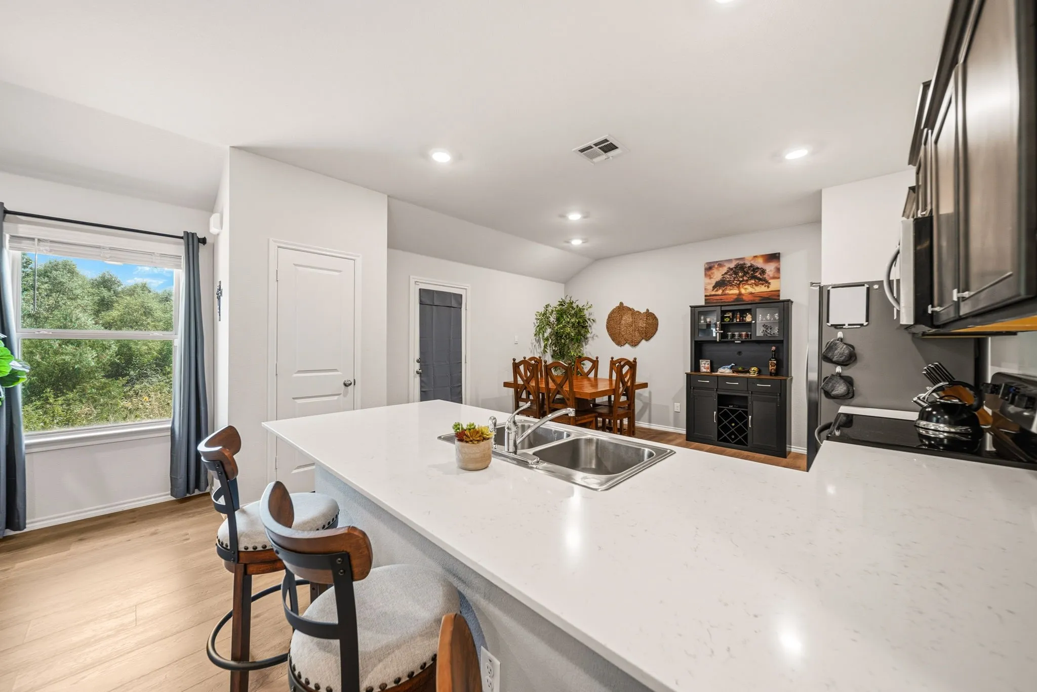 Kitchen island with an undermount double basin stainless steel sink
