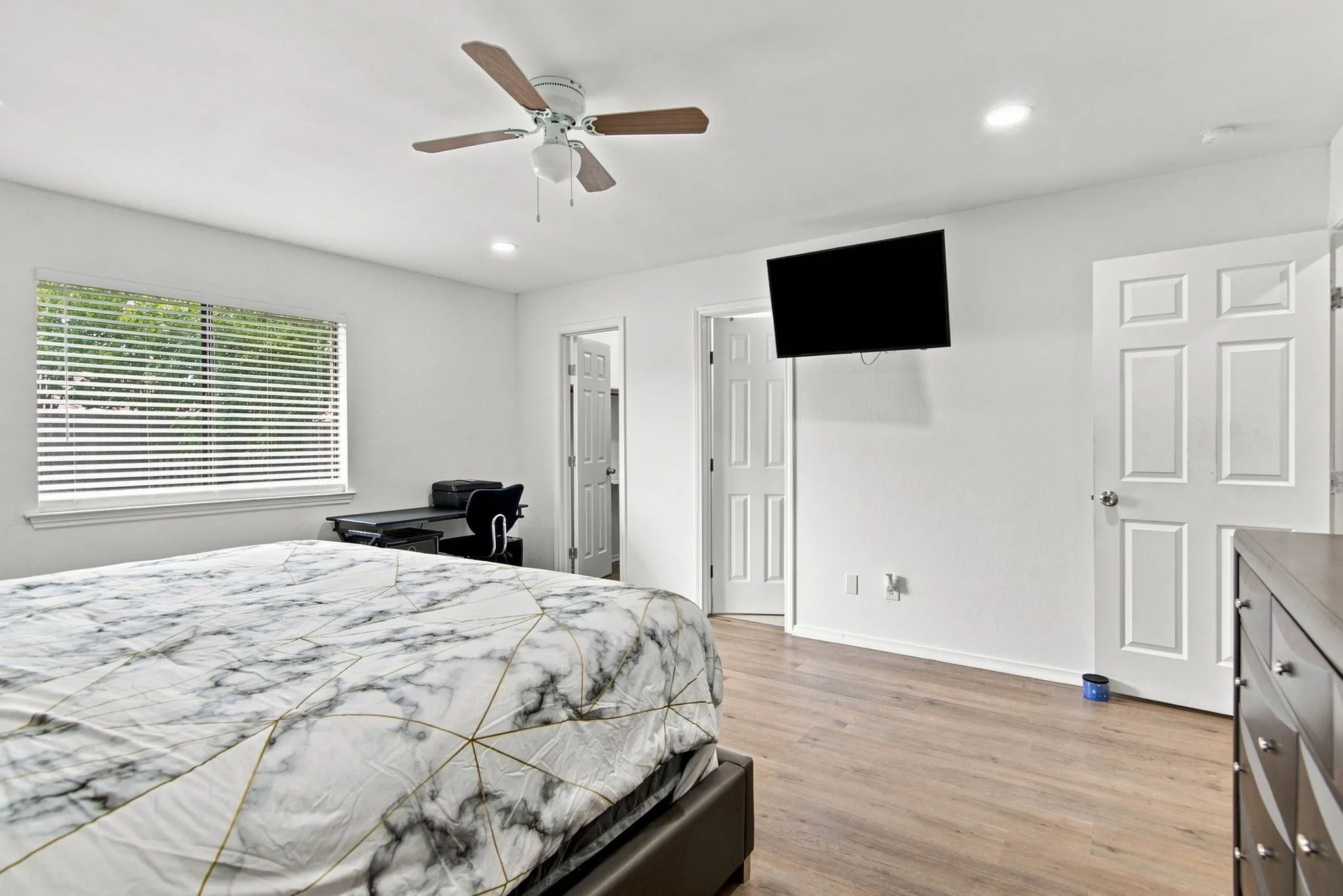 Wood-finish flooring with white walls
