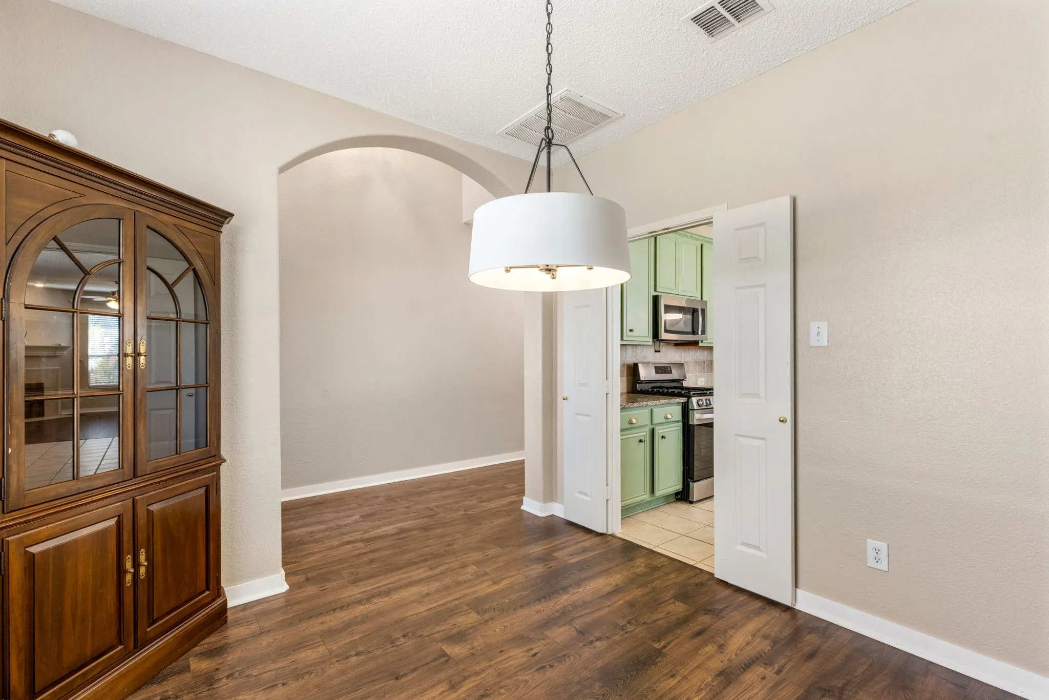 Wood-finish flooring throughout, complemented by light-toned wall finishes