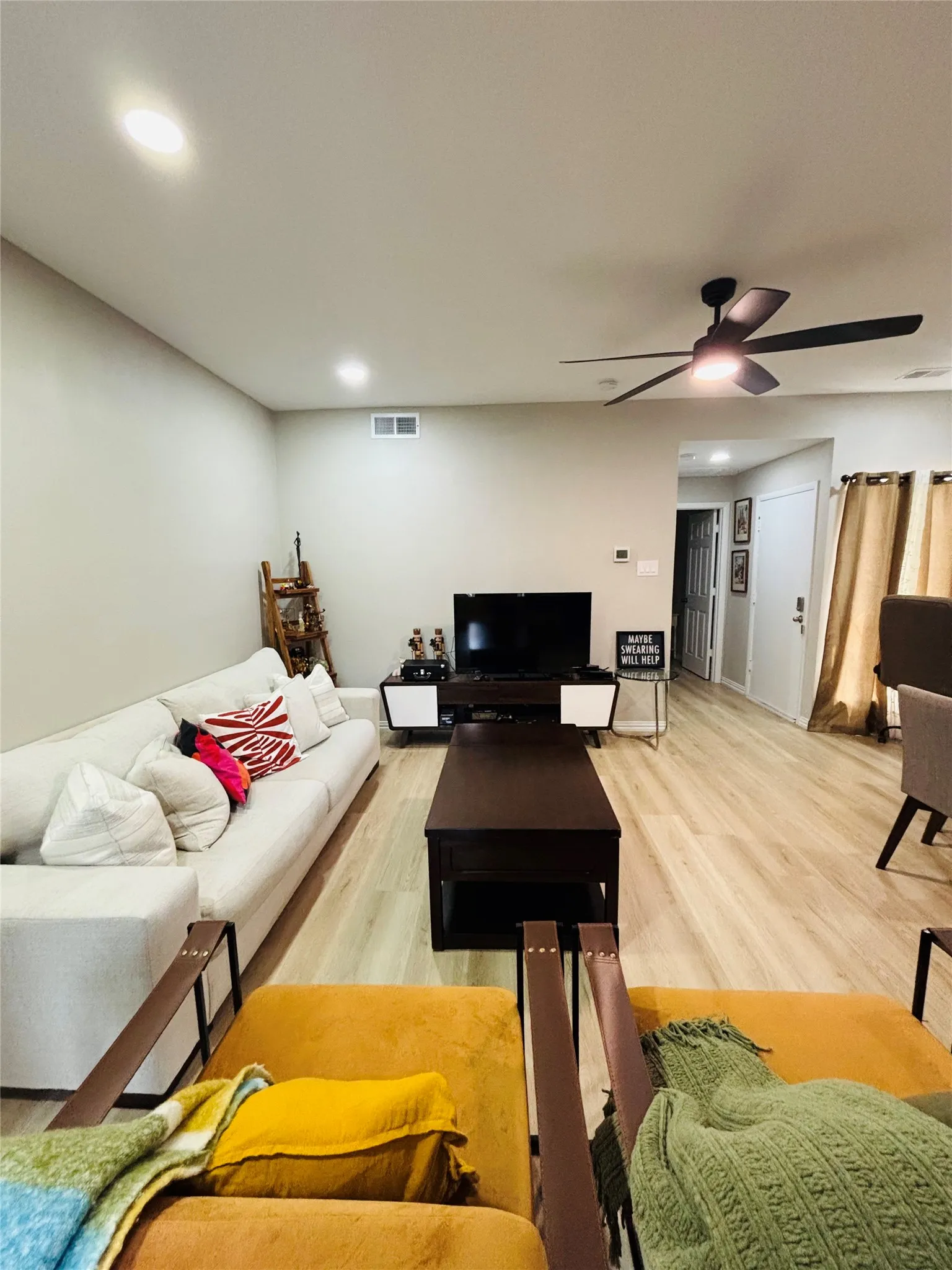 Recessed lighting, ceiling fan, wood-finish flooring, light-toned walls, and white trim