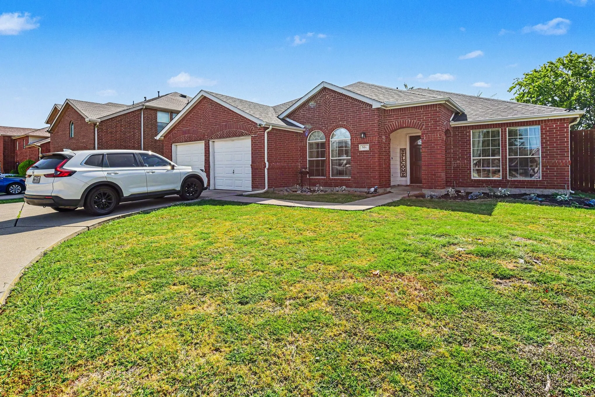 Red brick exterior with white trim