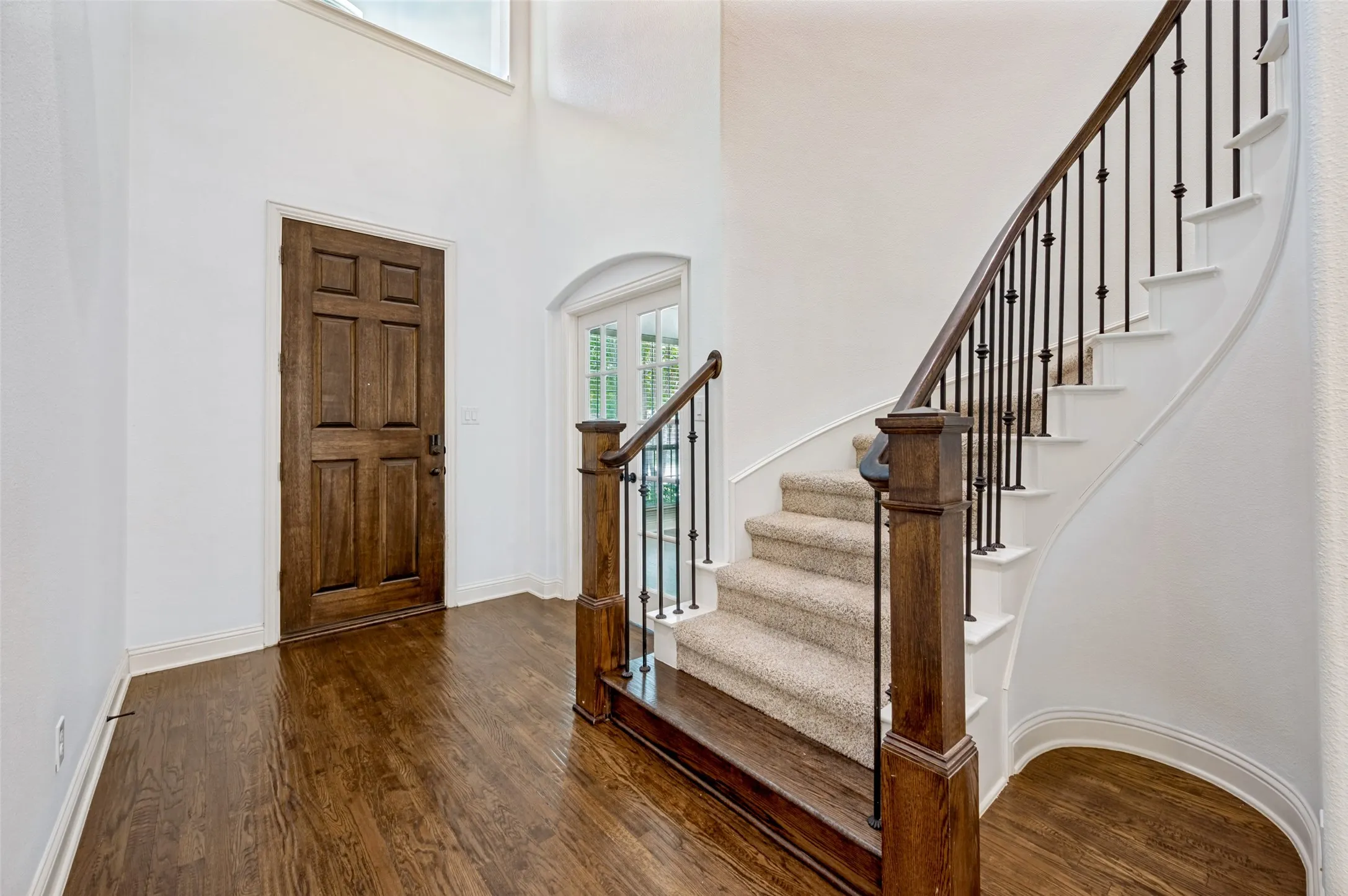 Elegant entryway with a soaring ceiling