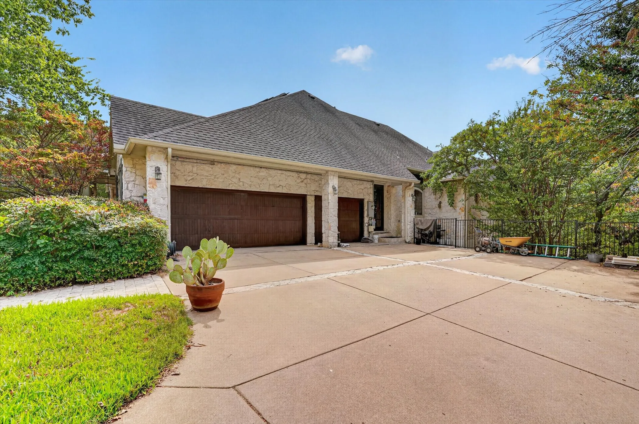 Oversized 3-car garage with epoxy flooring and a circle driveway