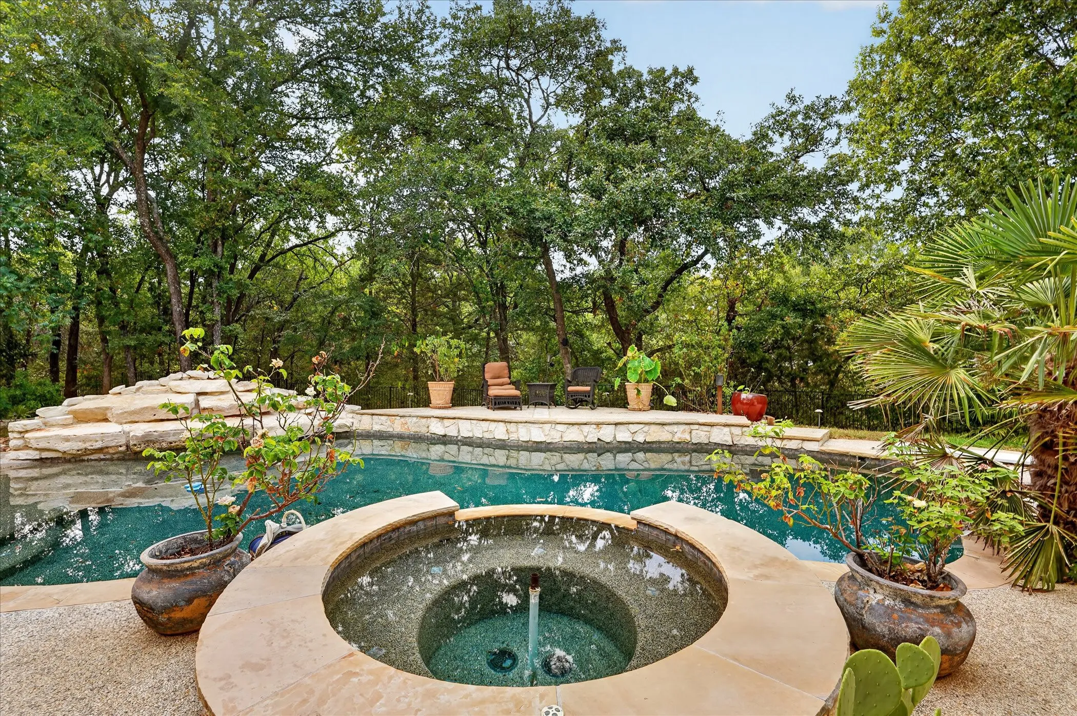 Paradise awaits in your resort-style backyard boasting a PebbleTec pool and spa with water features, a spacious patio, and gorgeous views.