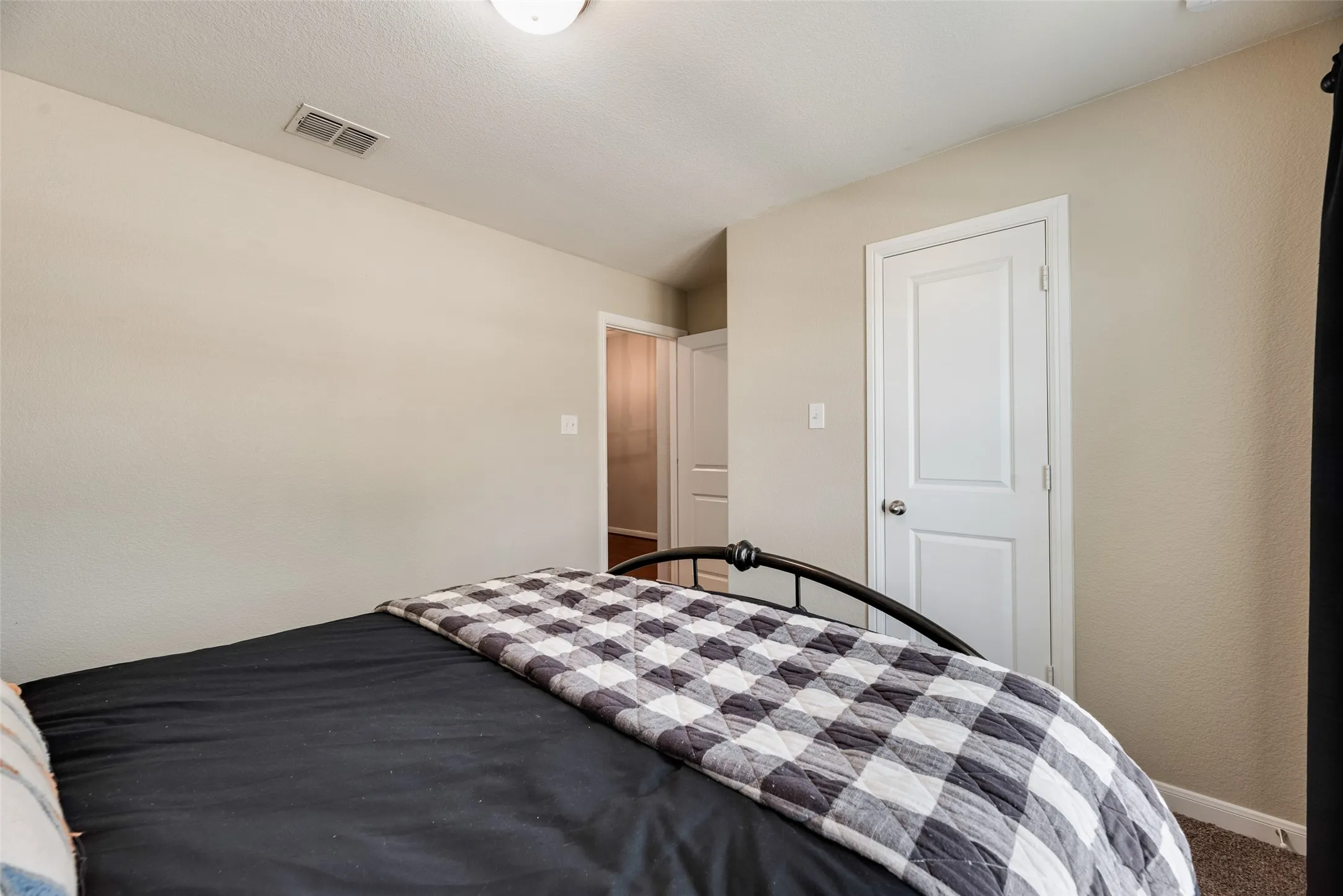 Neutral-toned walls, white trim, and a flush mount ceiling light
