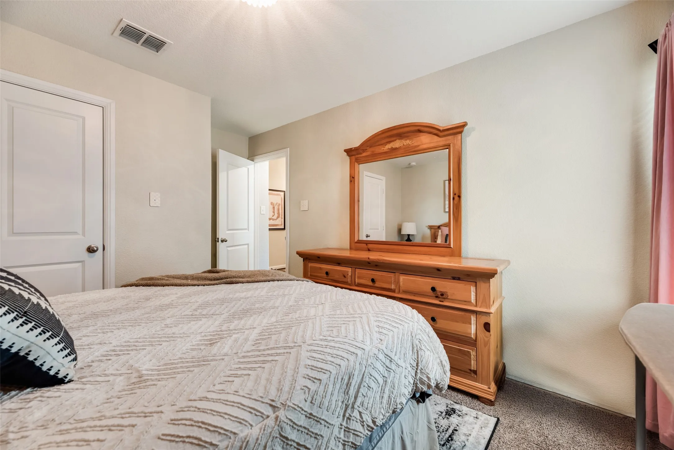 Neutral wall tones, panel doors, and recessed lighting