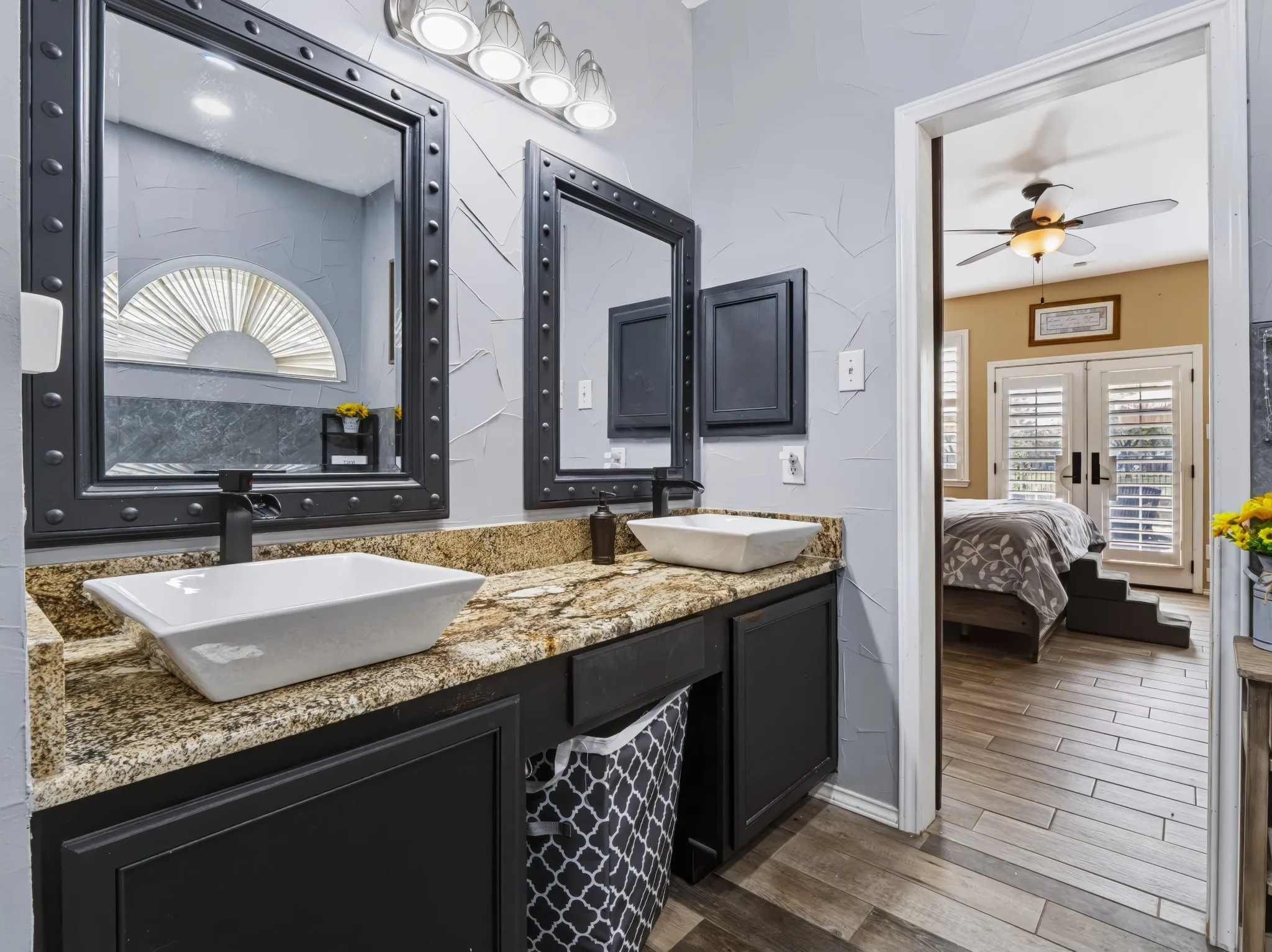 Dual vessel sinks with waterfall-style faucets