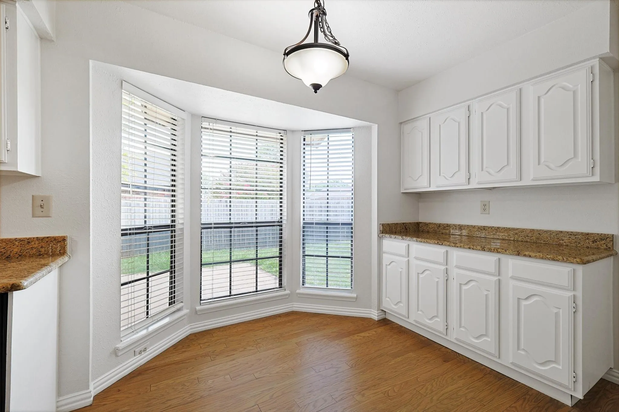Breakfast Area with abundant natural lighting and breakfast/coffee bar/serving area with storage.