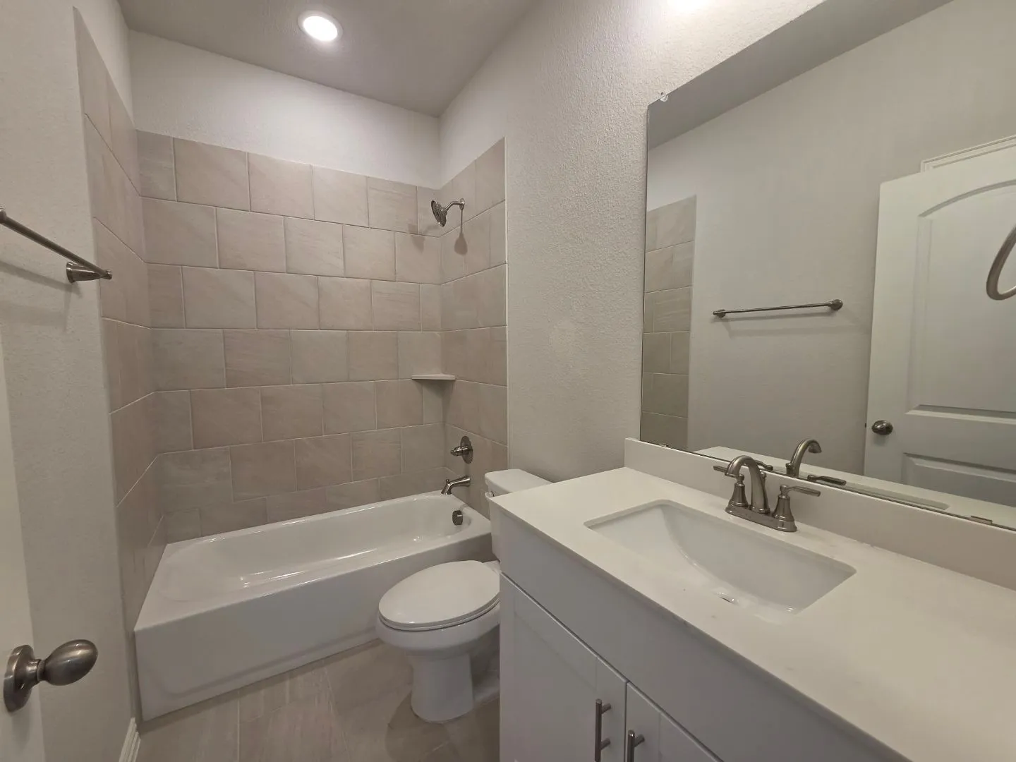 White vanity with dual-handle faucet and integrated sink
