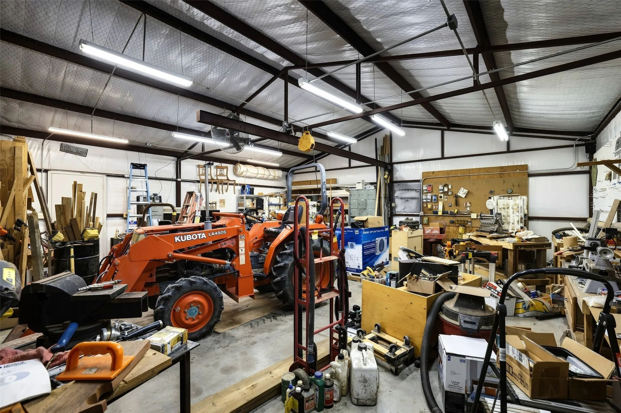 Insulated workshop has hoist lift, air compressor and dust collection system