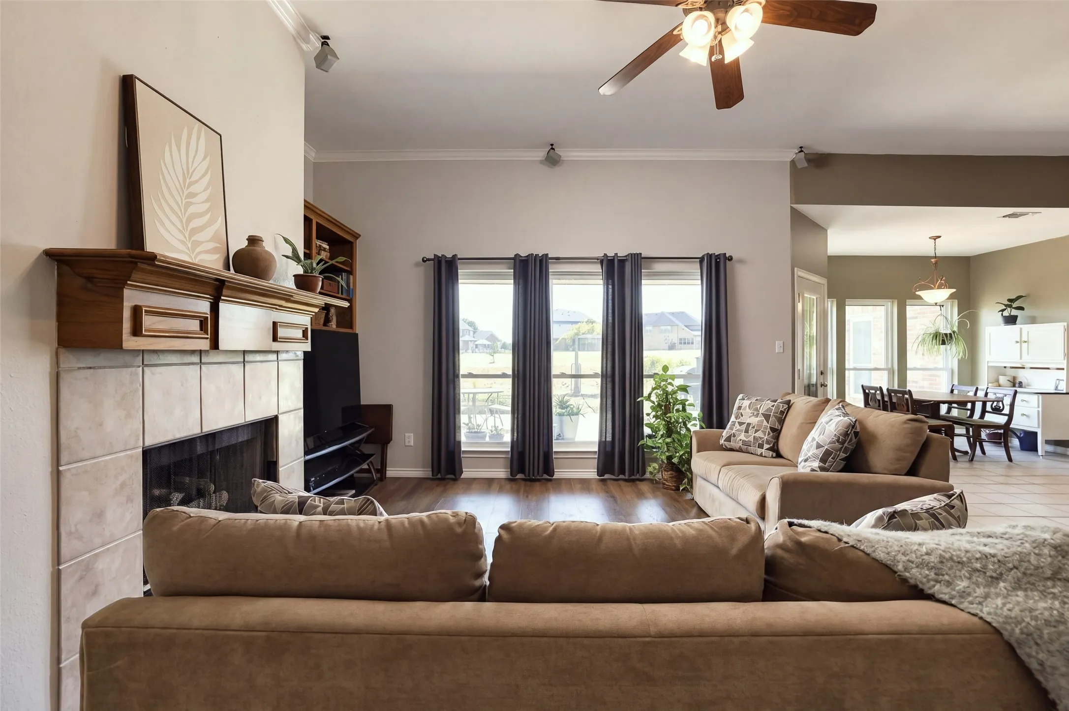 Natural light floods the living and breakfast areas through the recently replaced large windows