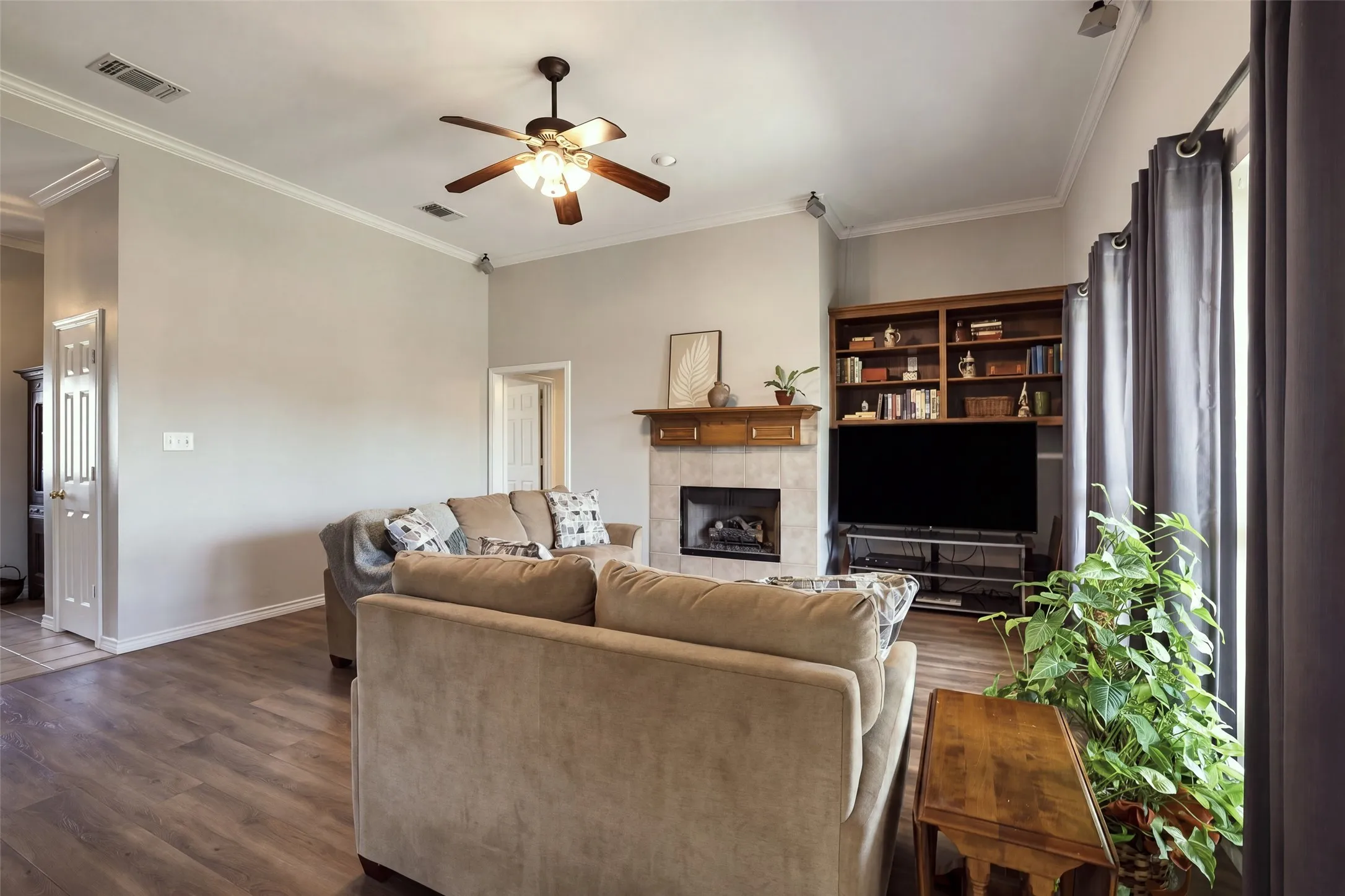 Decorative fireplace with built-in shelves is the focal point of the living room