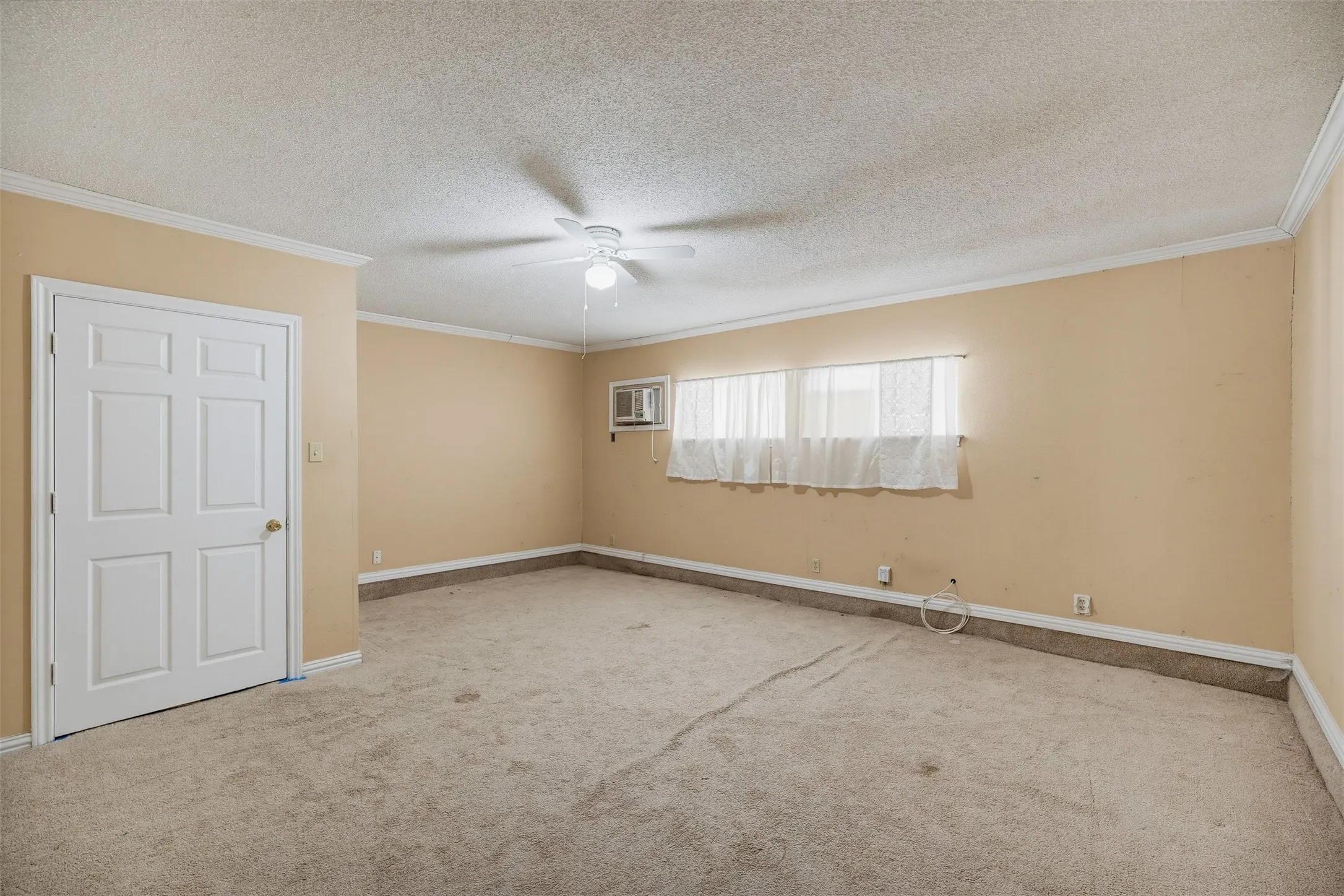 Ceiling fan fixture and a window-mounted air conditioning unit