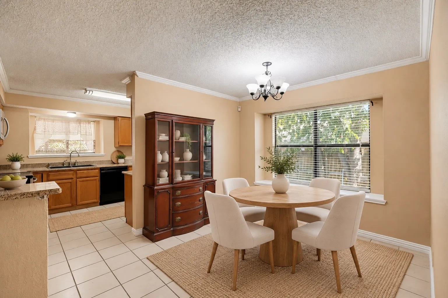 Kitchen with wood-finish cabinetry, black appliances, and granite-style countertops