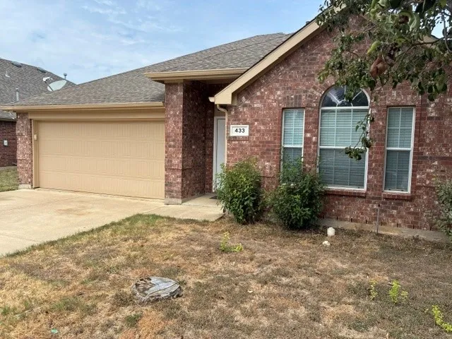 Red brick exterior with an arched window accent