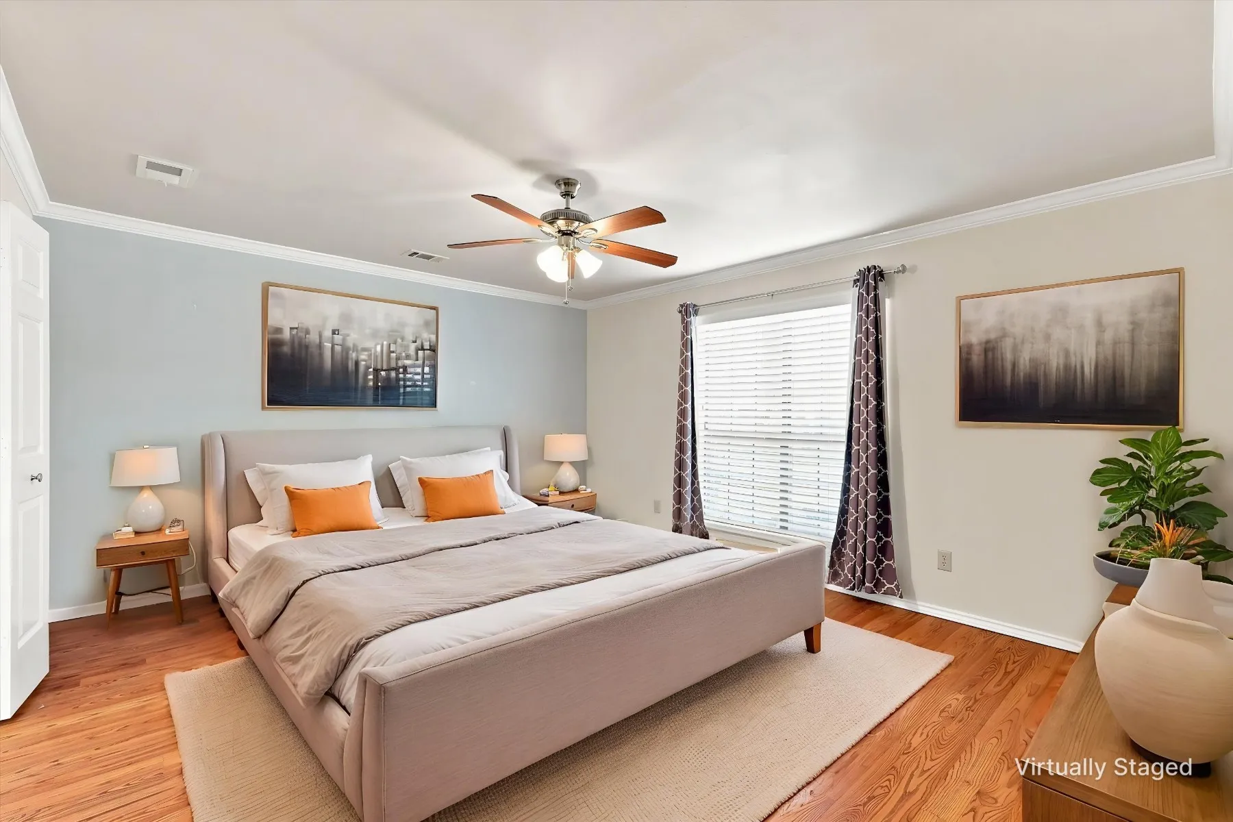 Wood-finish flooring, crown molding, ceiling fan, and window with blinds