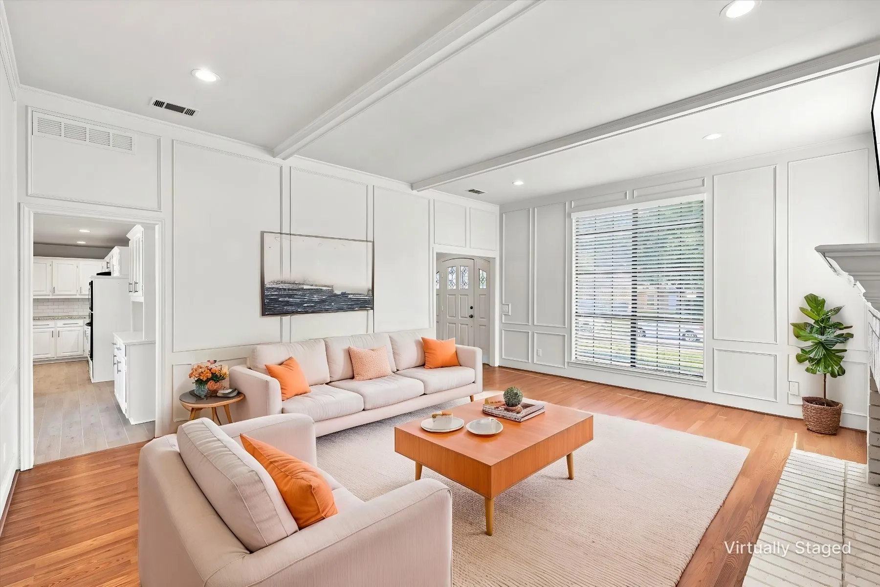 Hardwood flooring, recessed lighting, and white wainscoting details