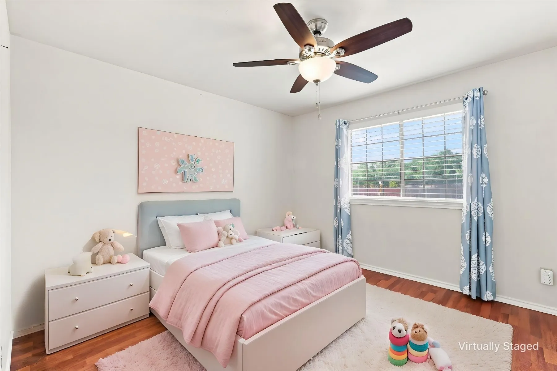 Wood-finish flooring, ceiling fan with integrated lighting, and a large window with blinds