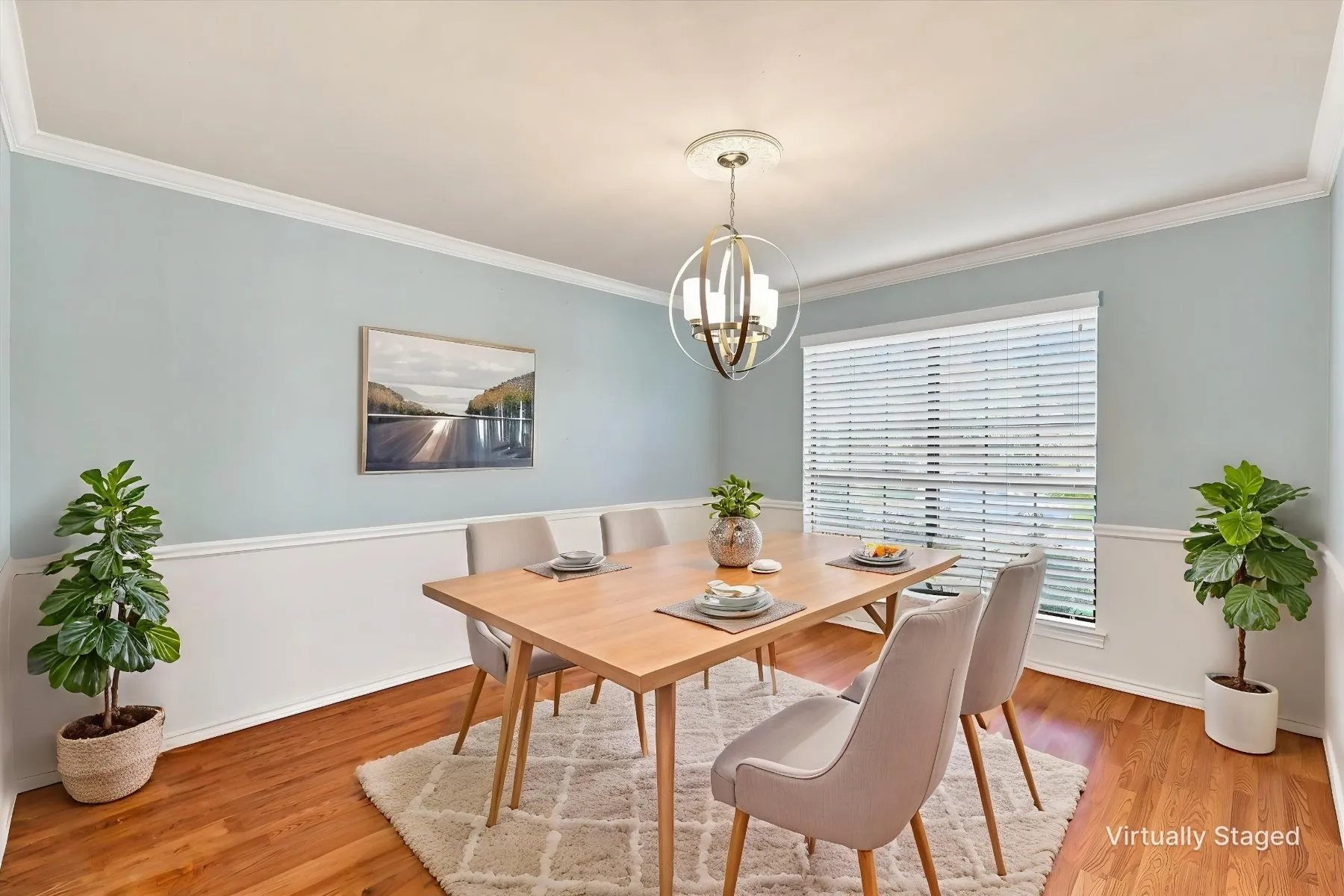 Hardwood flooring with crown molding and wainscoting