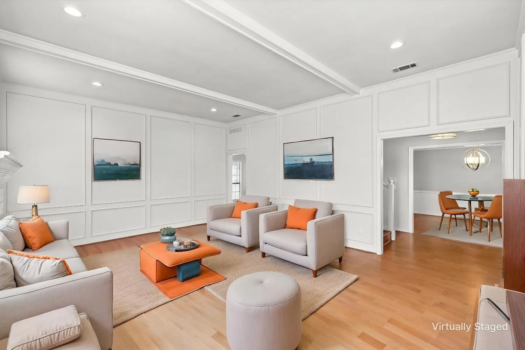 Light wood-finish flooring, recessed lighting, and white paneled walls define this space