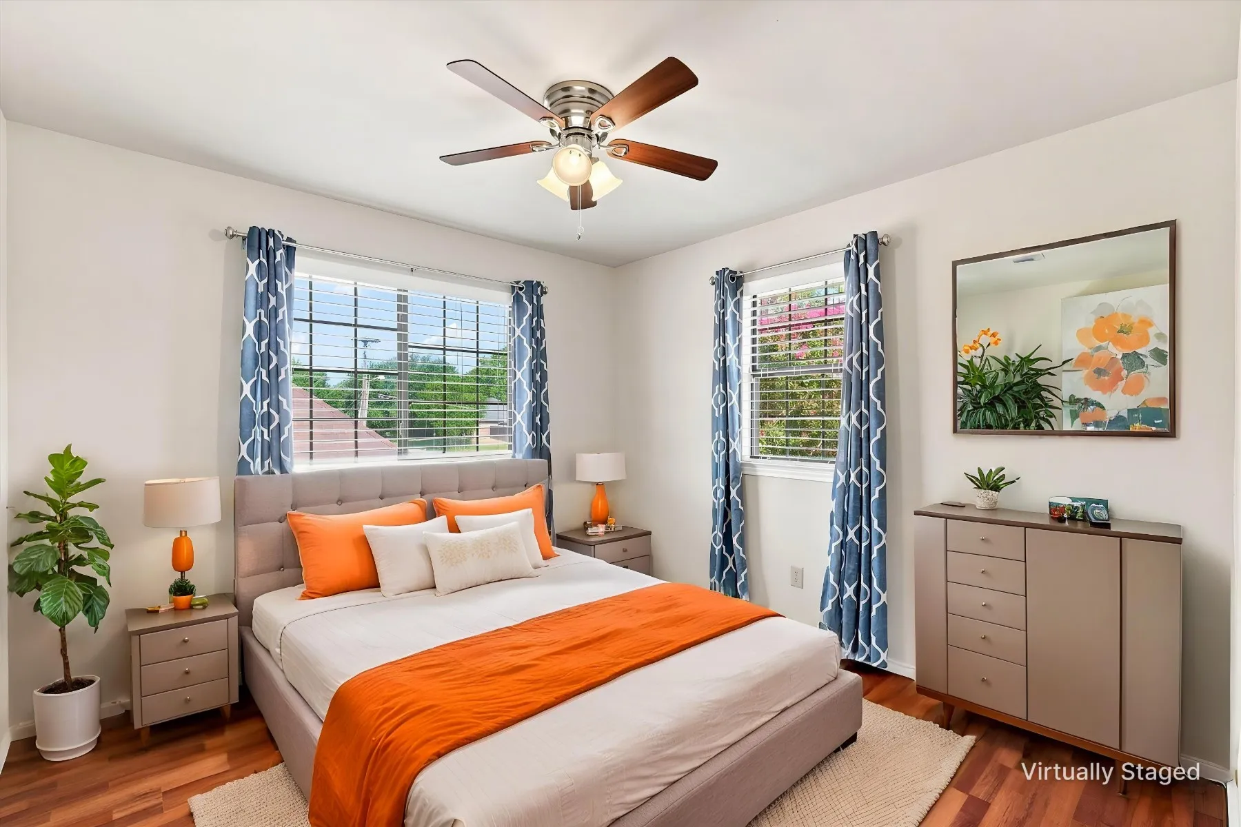 Wood-finish flooring with a ceiling fan light fixture