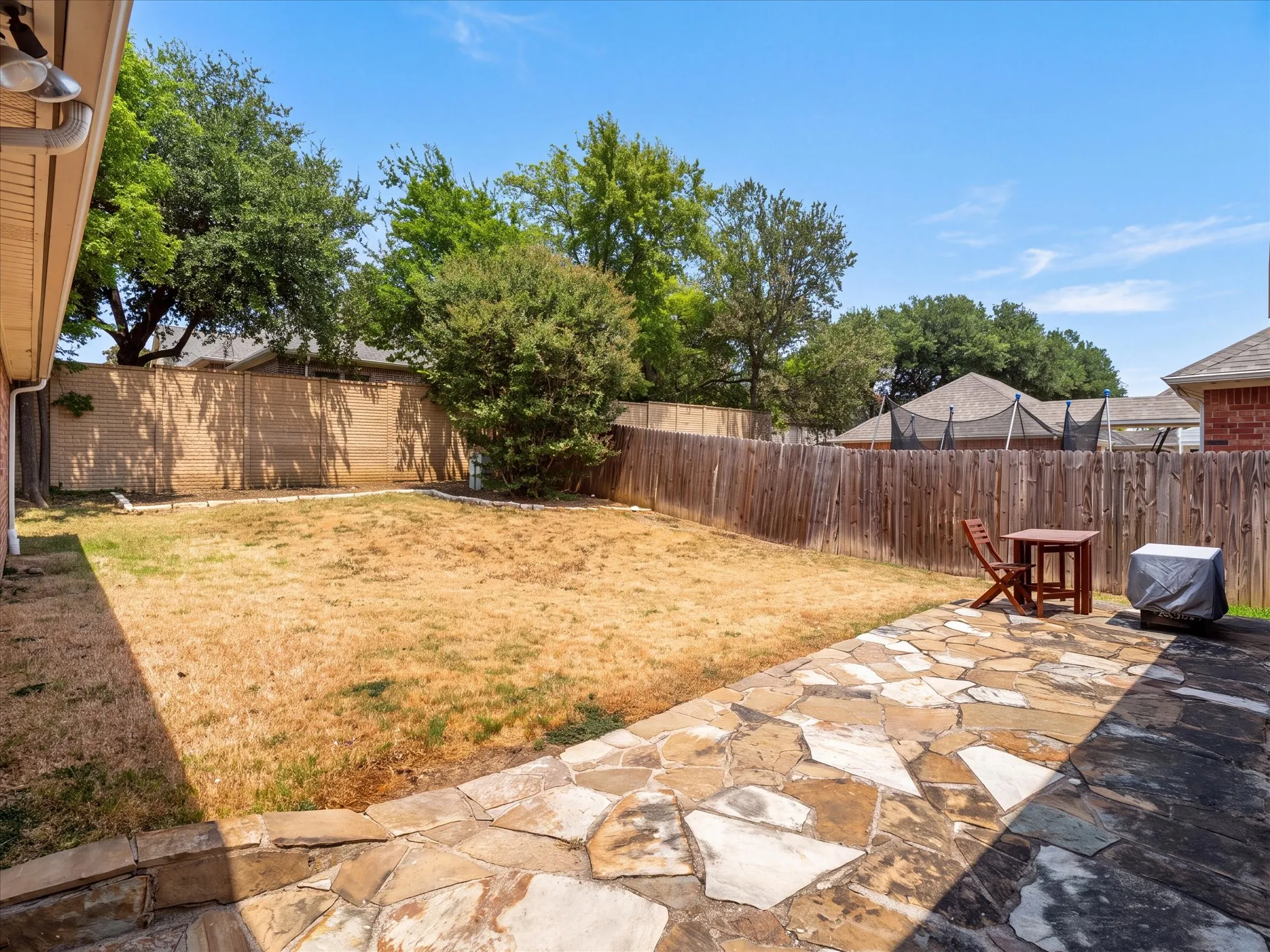 Generous backyard offering endless possibilities for outdoor living