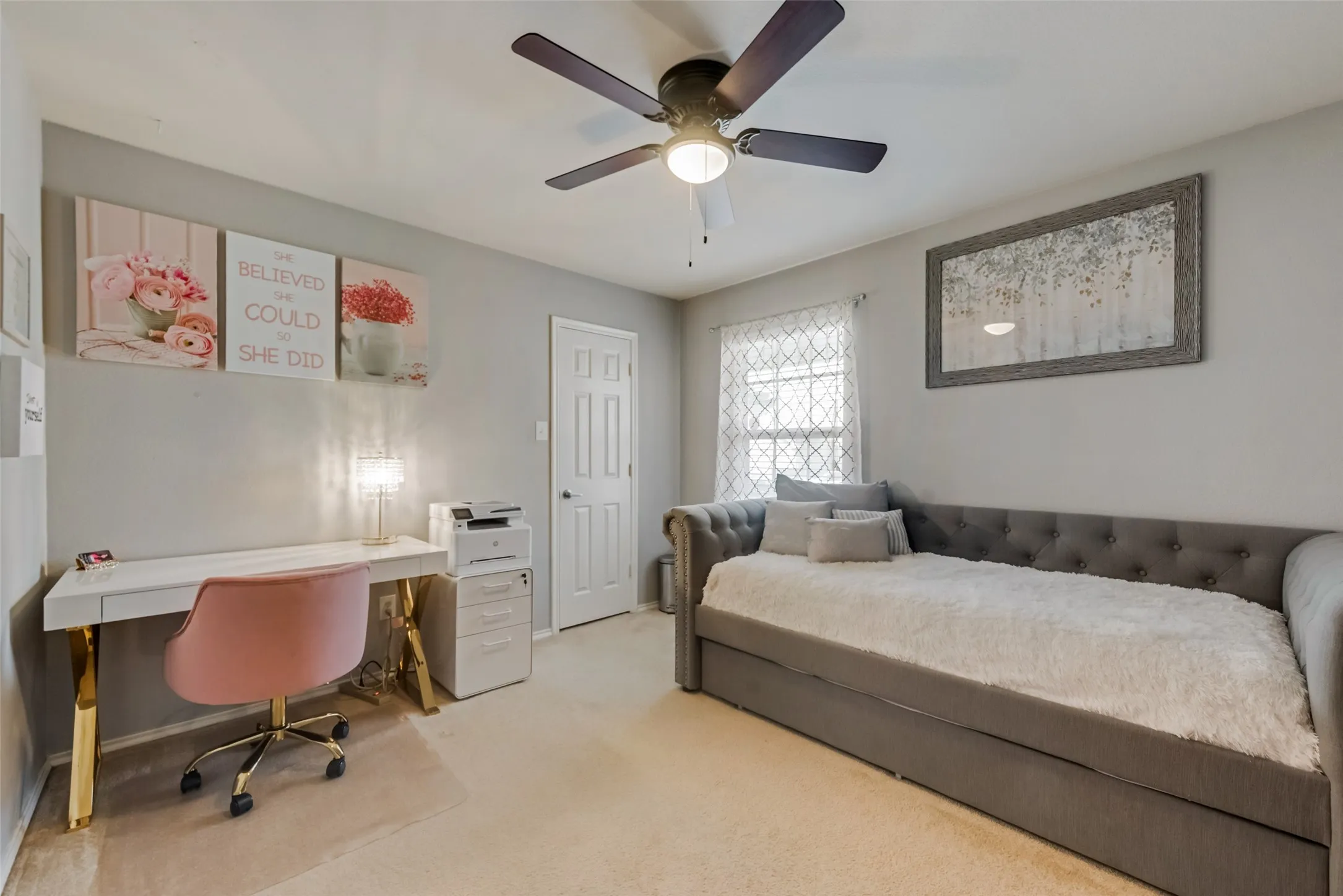 Neutral-toned walls, ceiling fan with integrated lighting, and carpeted flooring