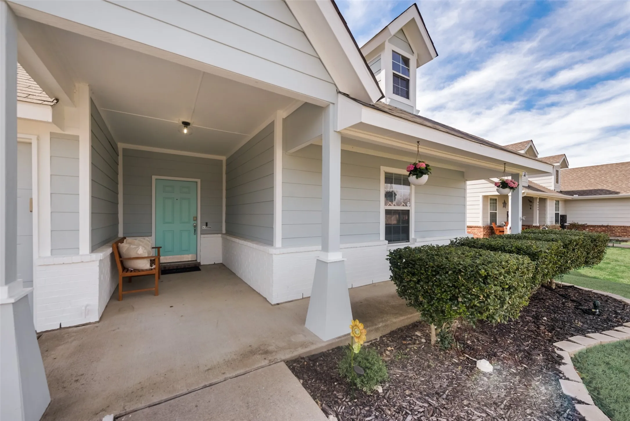 Covered front entry with siding exterior
