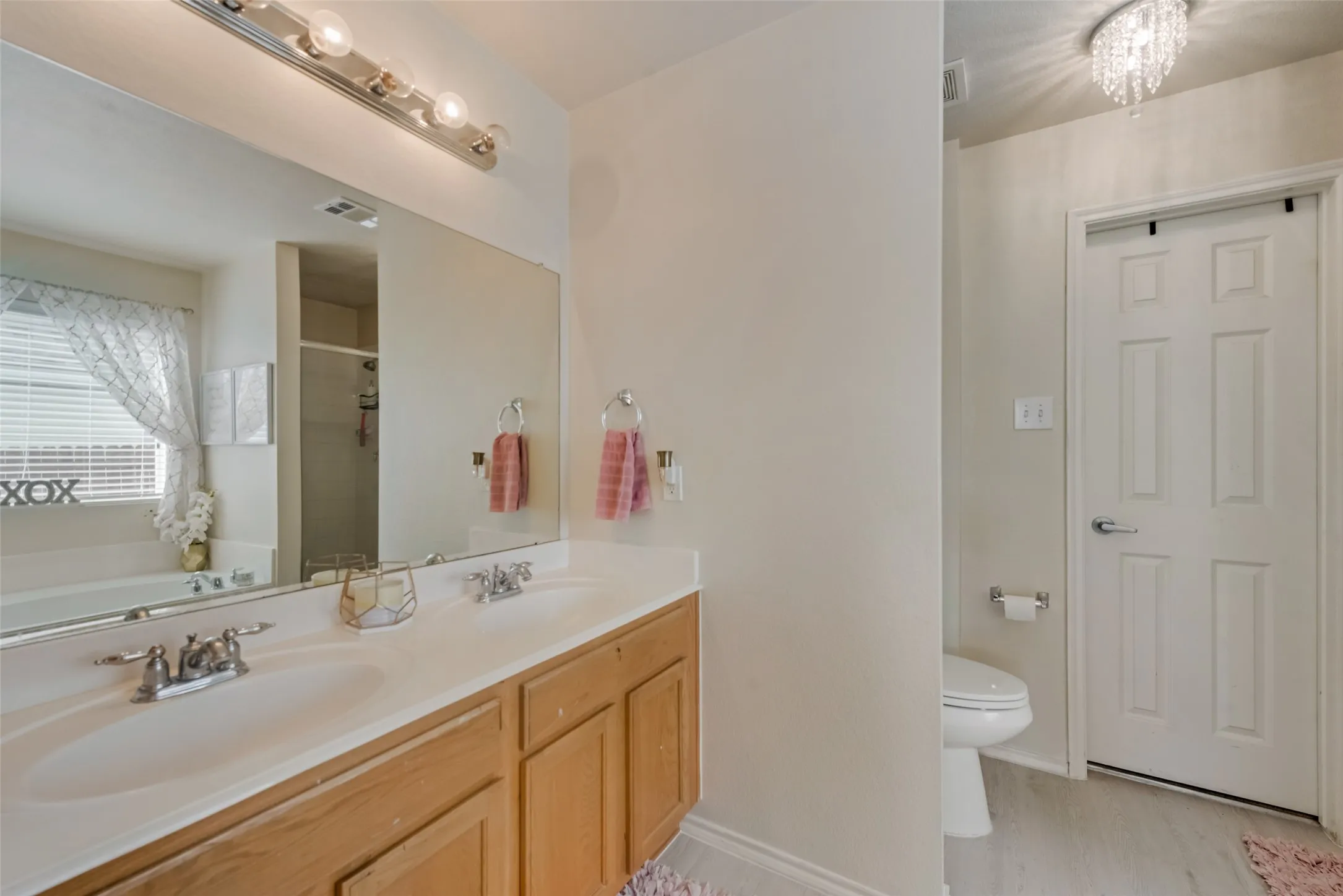 Dual vanity with undermount sinks and chrome fixtures