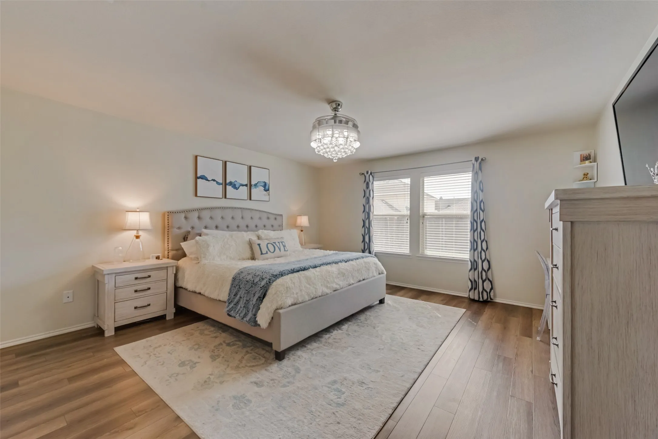 Wood-finish flooring with a ceiling fan light fixture