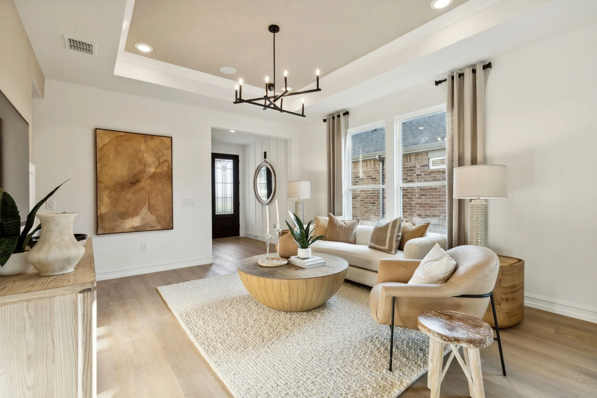 *Model Representation - Spacious gathering room with large windows