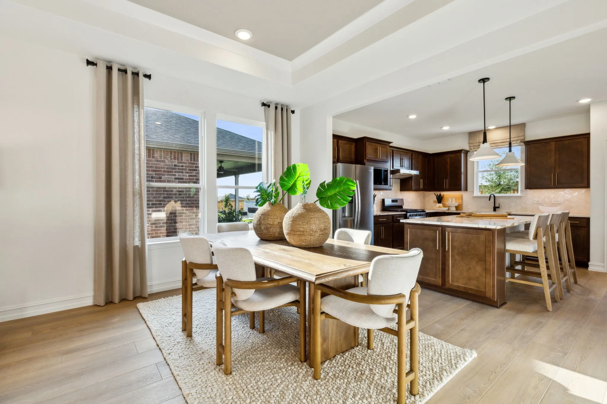 *Model Representation - Dining area off kitchen with large windows
