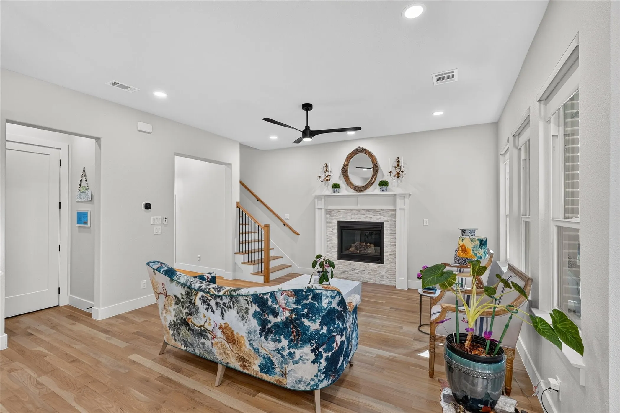 Wood-finish flooring, recessed lighting, and a modern ceiling fan
