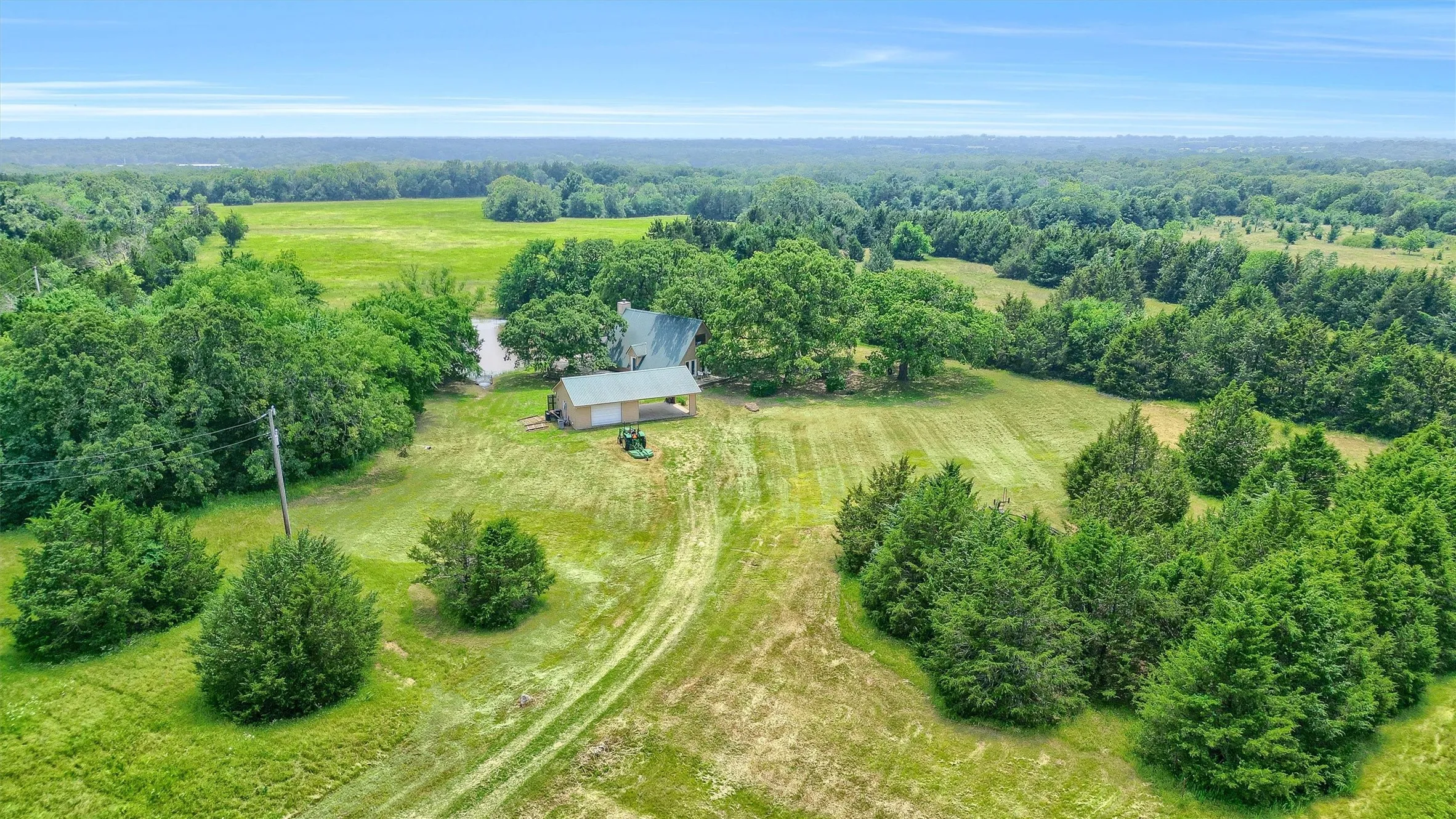 Birds eye view of property with a rural view