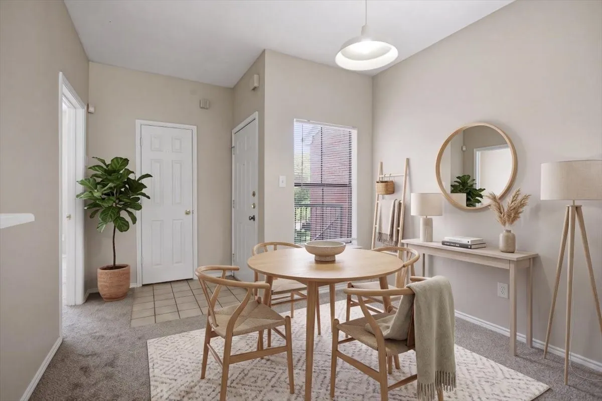 Entry opens into a welcoming dining space or could be a second living space (virtually staged)