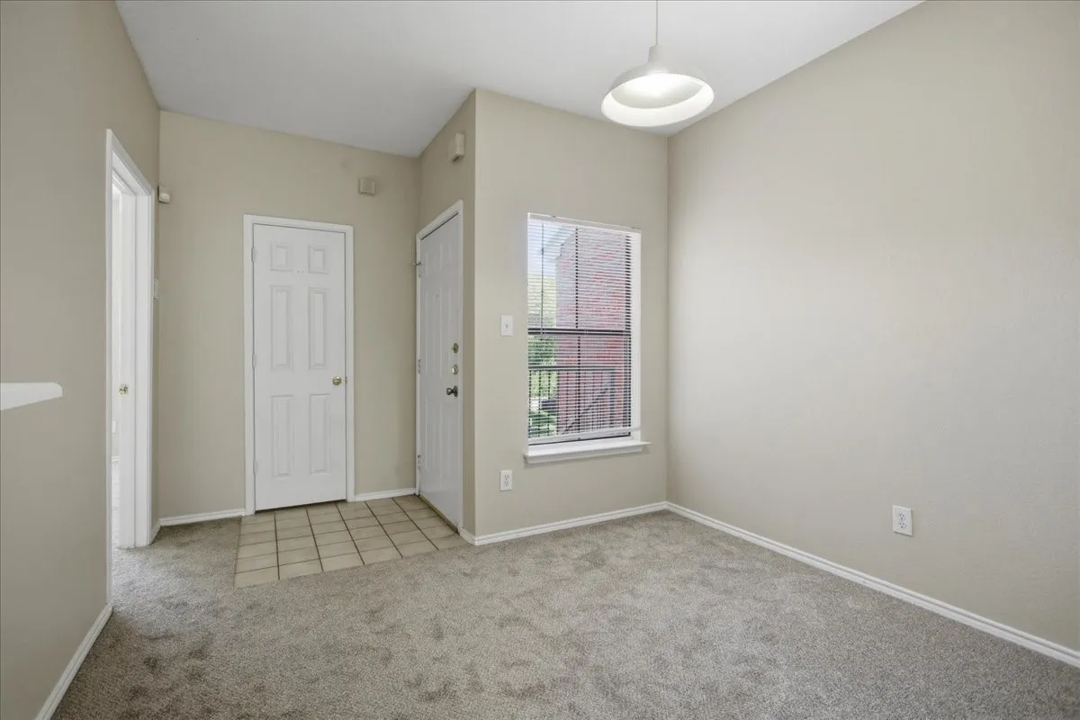 Entry into the dining or second living space (unstaged)