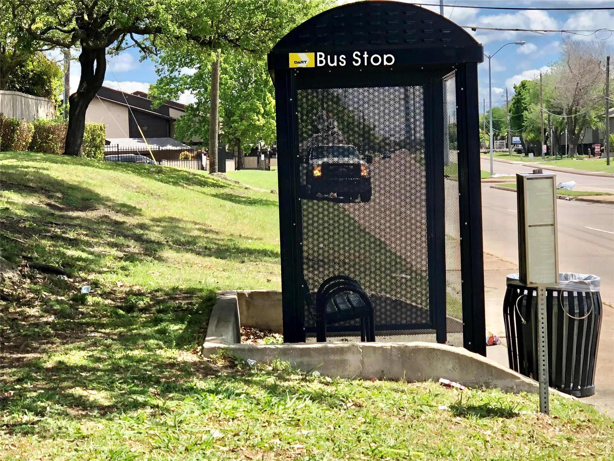 Bus stop in front of complex