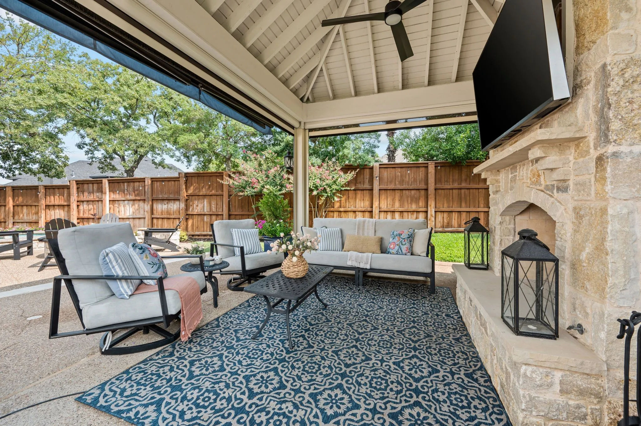 The outdoor living feels equally suited to a quiet afternoon or a full house, with a fireplace, television and plenty of room to settle in.