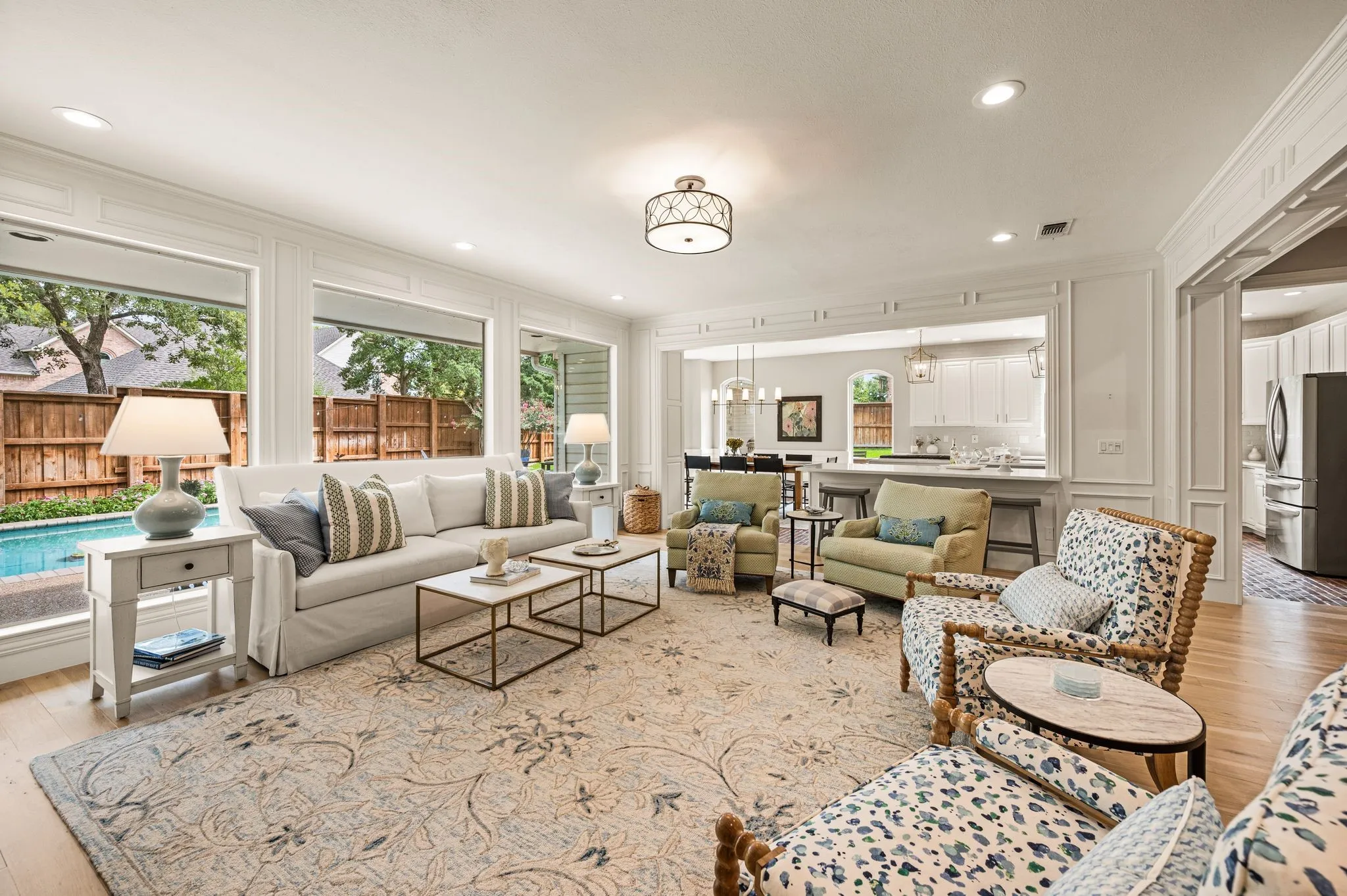 The main living room feels collected over time, with layered millwork, soft furnishings and an effortless connection to the kitchen and backyard.