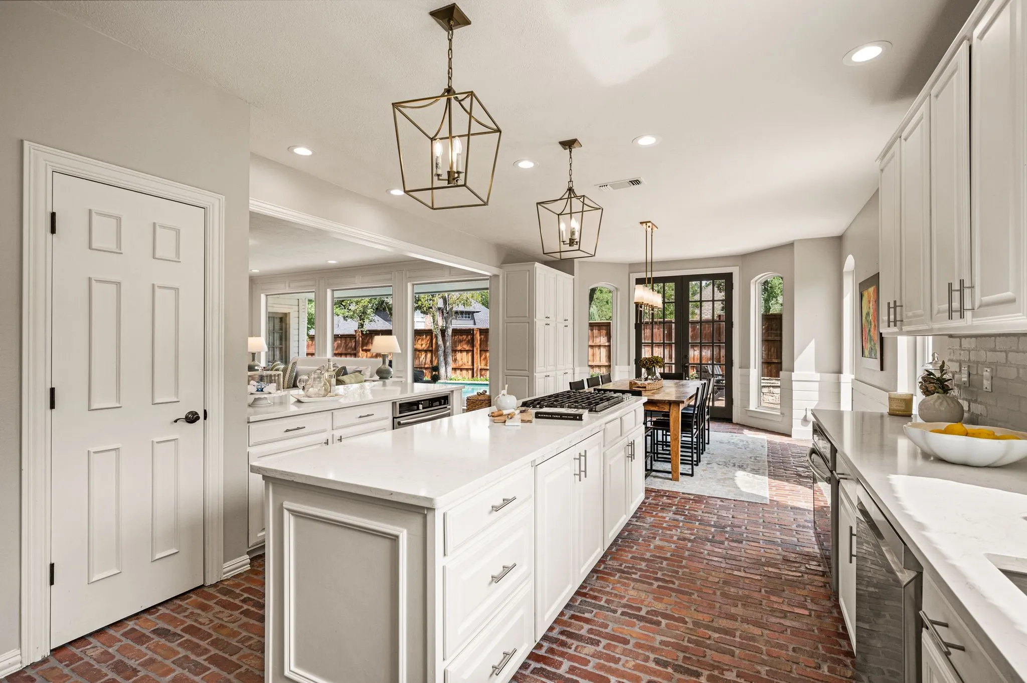 Generous counter space, dual islands and layers of cabinetry make the kitchen as functional as it is inviting.
