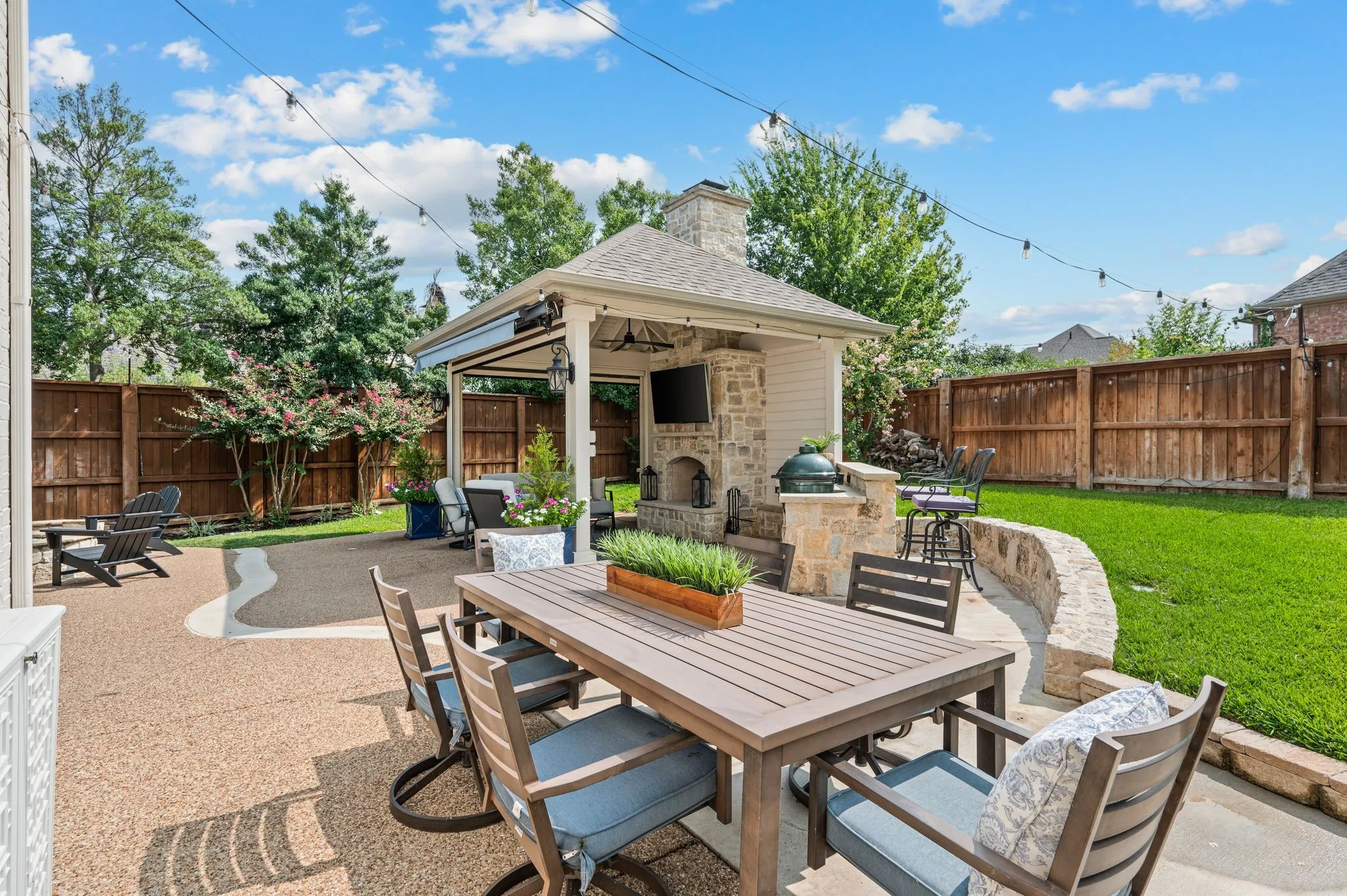 A separate dining area extends the outdoor living even further, creating another place for meals, conversation and long weekends at home
