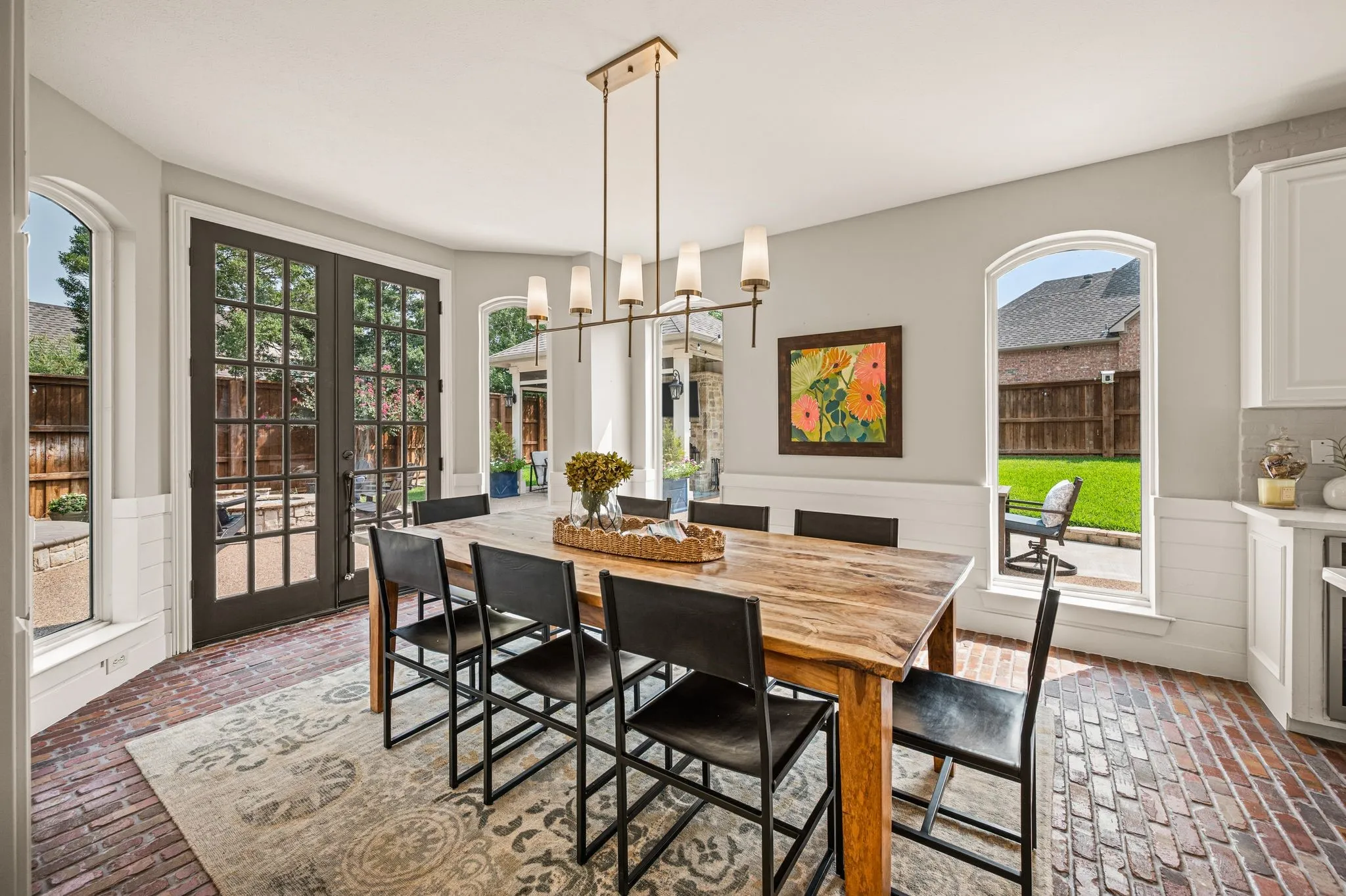 The breakfast room is made for long mornings and casual dinners, with natural light and direct access to the backyard just beyond.