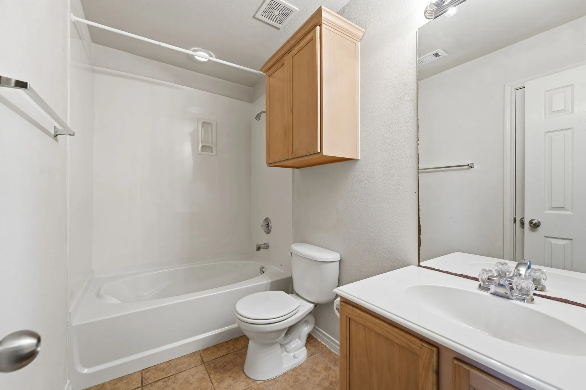 Second full bath with convenient access from both the bedroom and hallway.