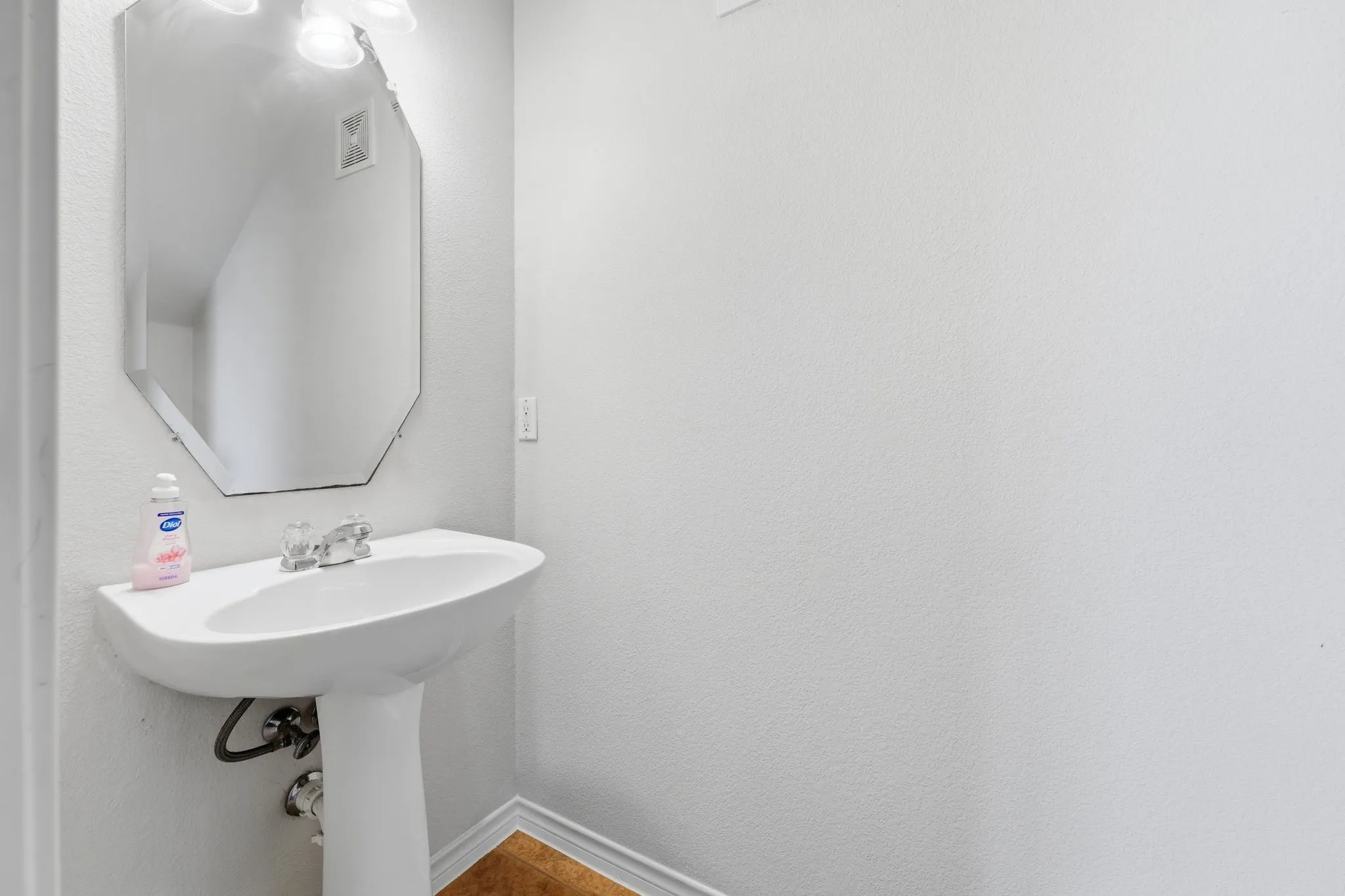 Convenient downstairs half bath for residents and guests.