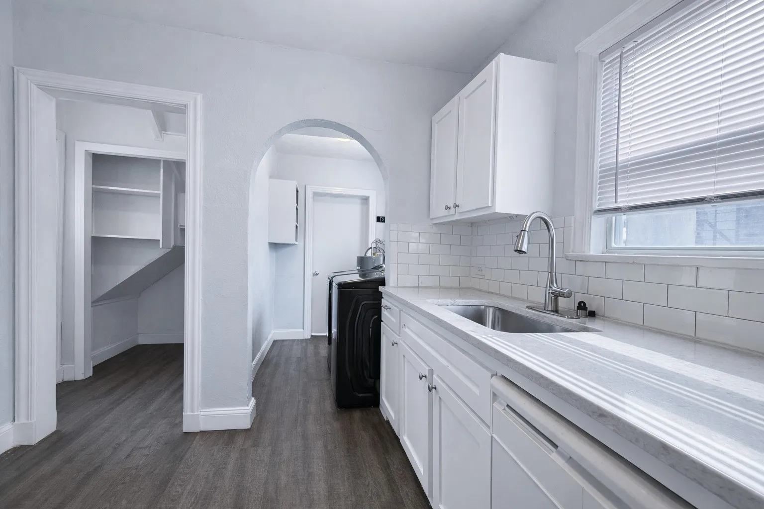 Historical arches in the house bring that cozy, Dallas charm.