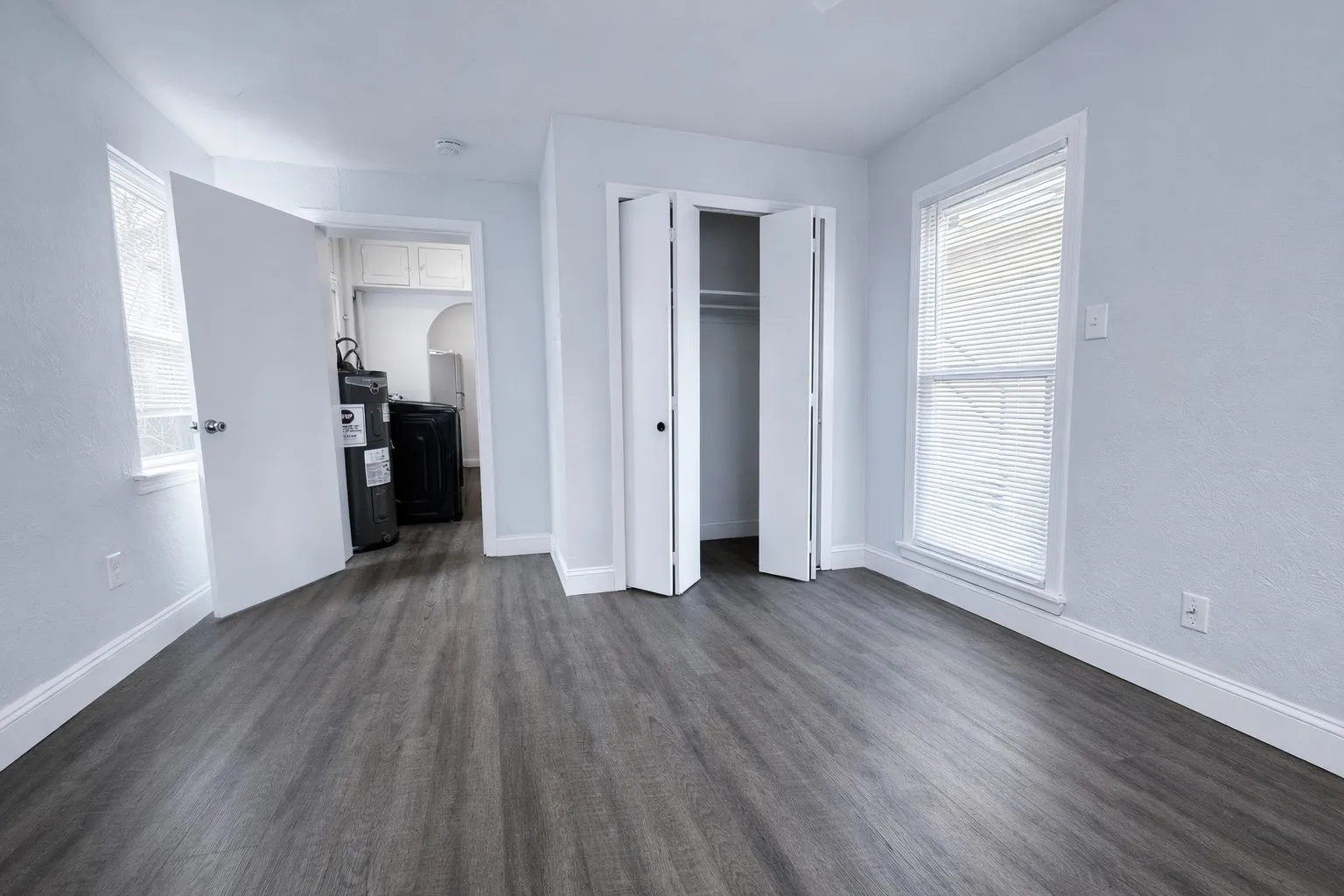 Large bedroom with a nice size closet that goes into the utility room.